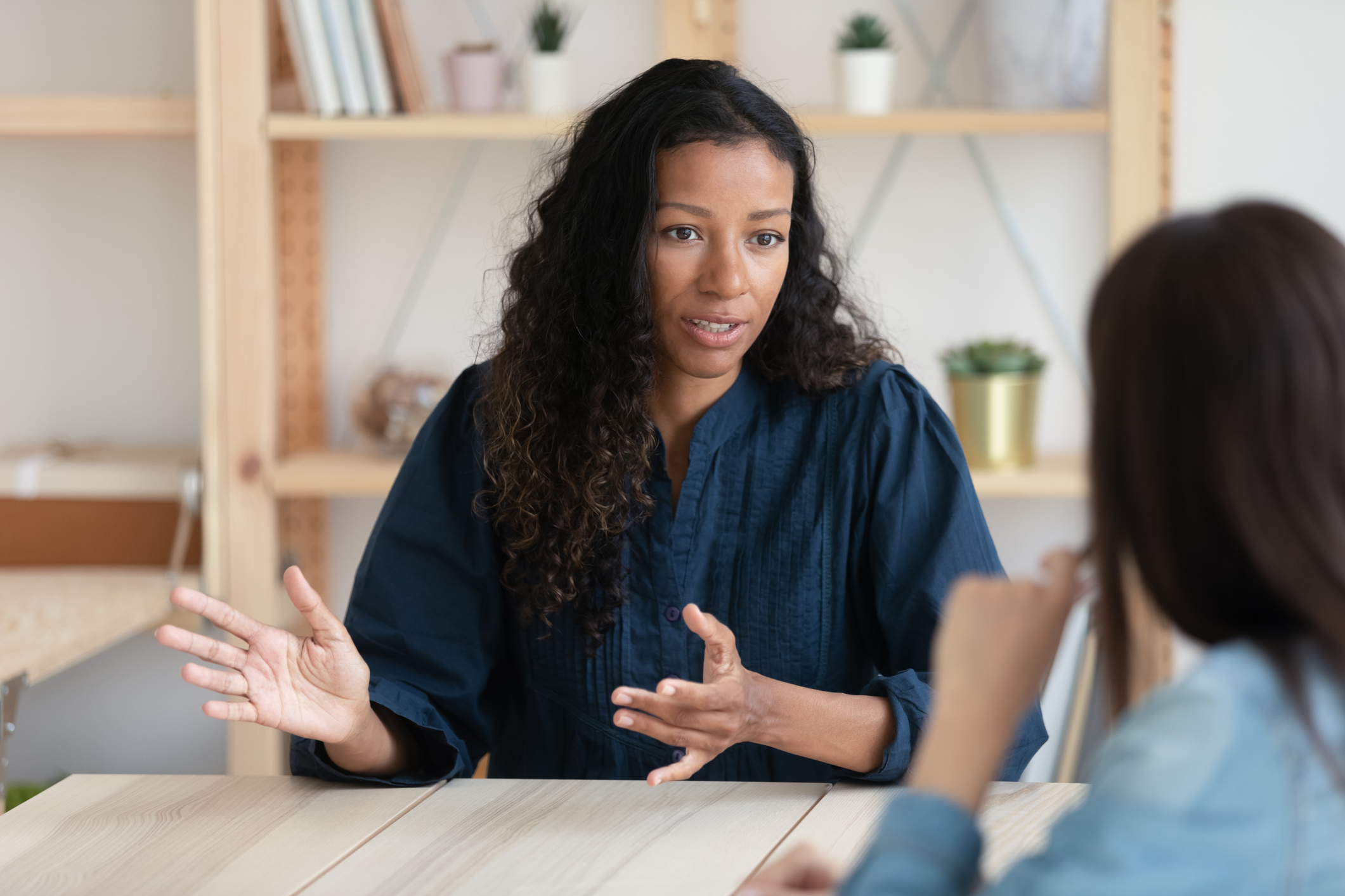 Close up confident african american businesswoman explaining new responsibilities.