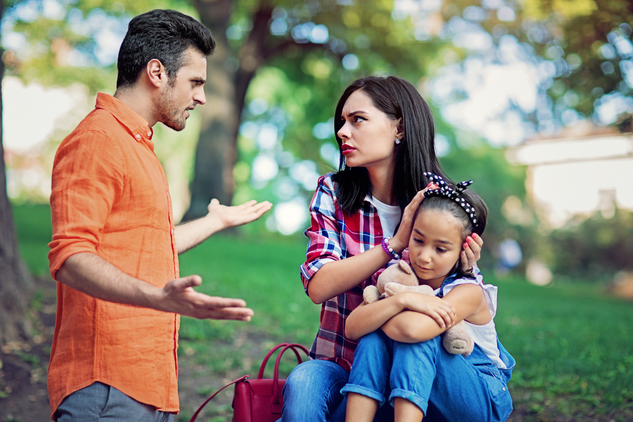 Husband arguing with wife in front of their little daughter