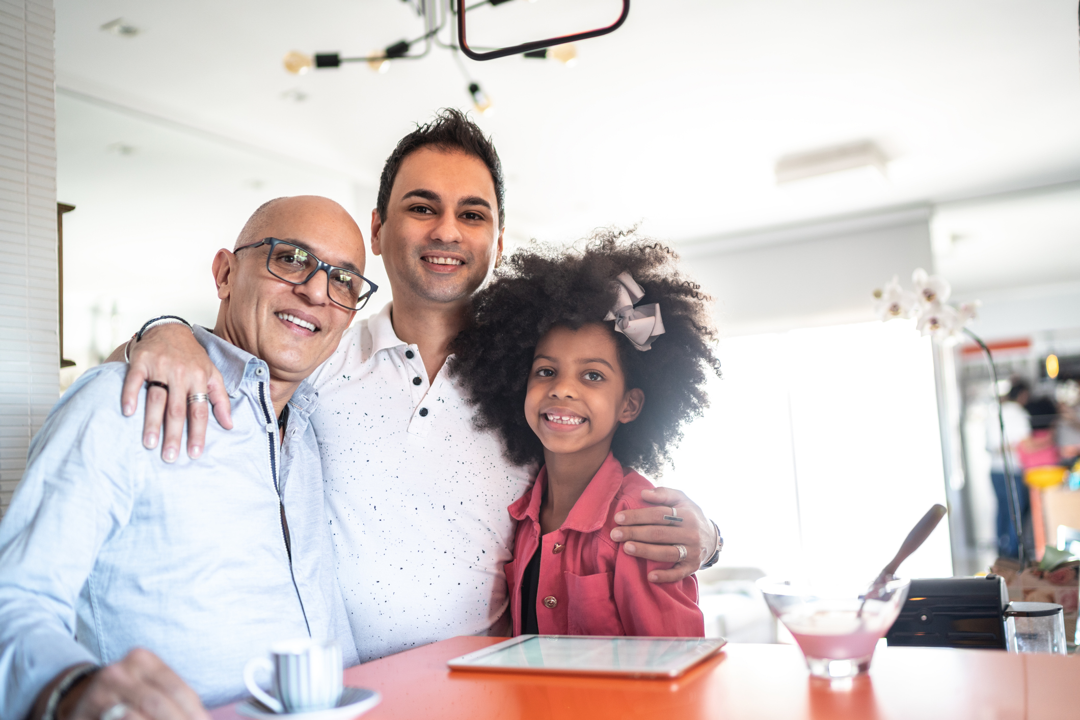 Portrait of a happy family embracing at home