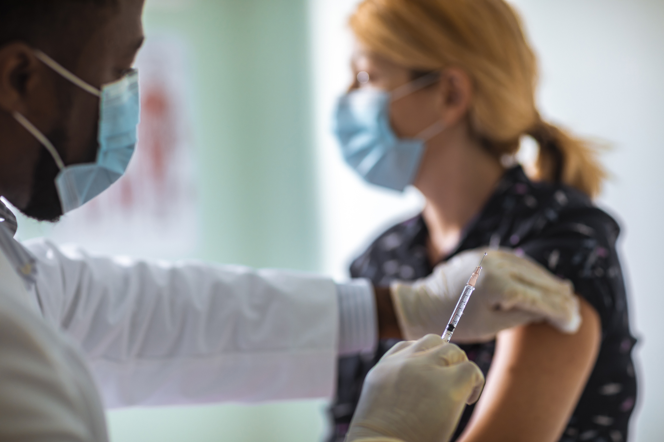 Young woman getting vaccinated