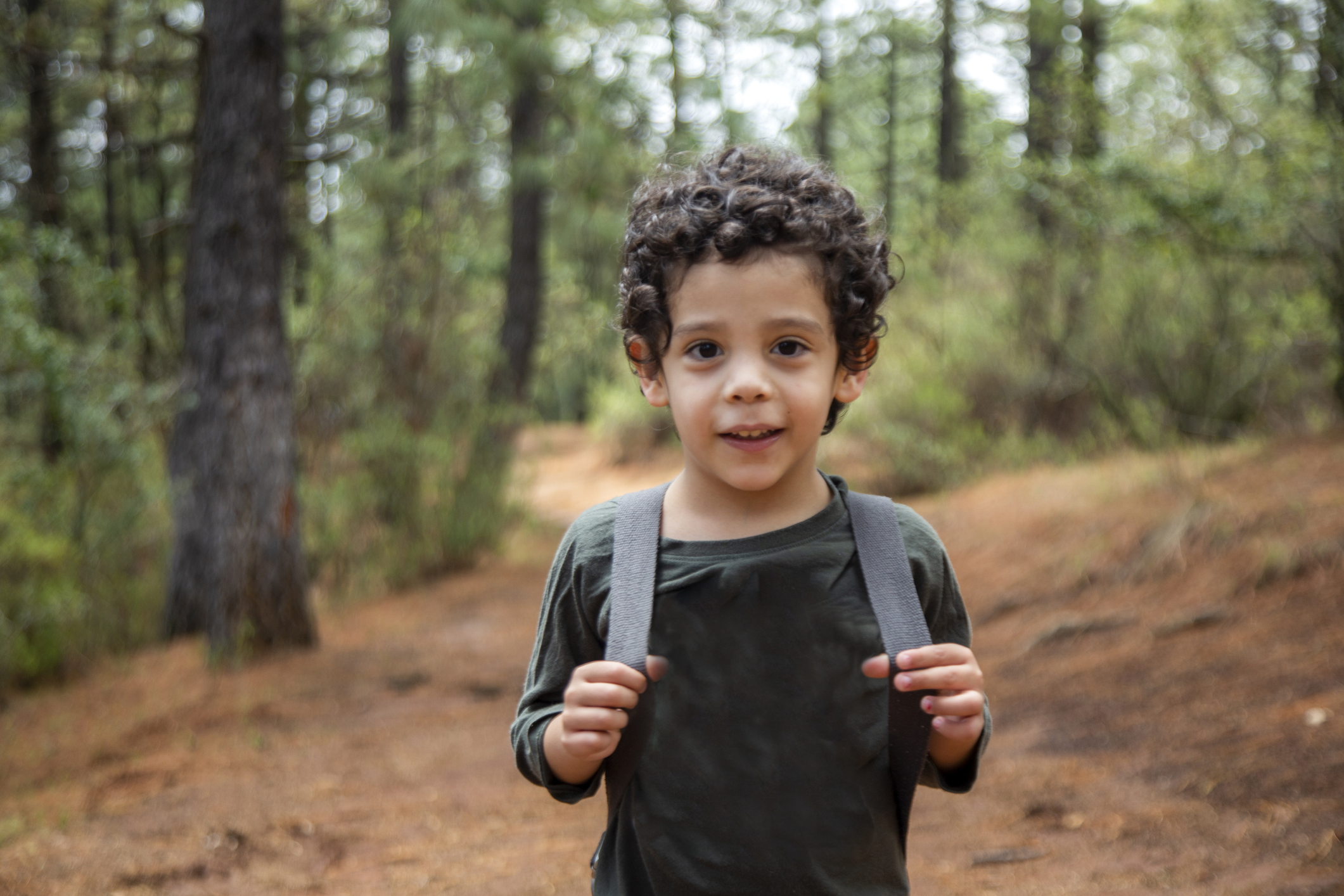 Child walking in the woods