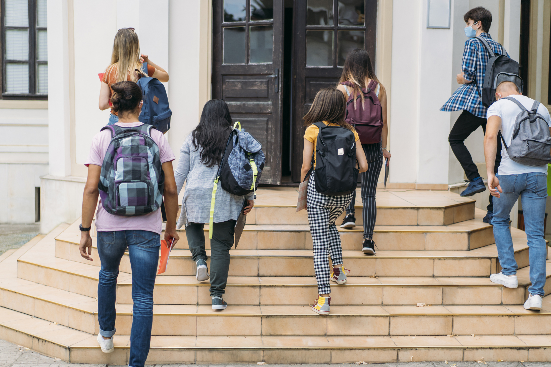 Group of students walking in college