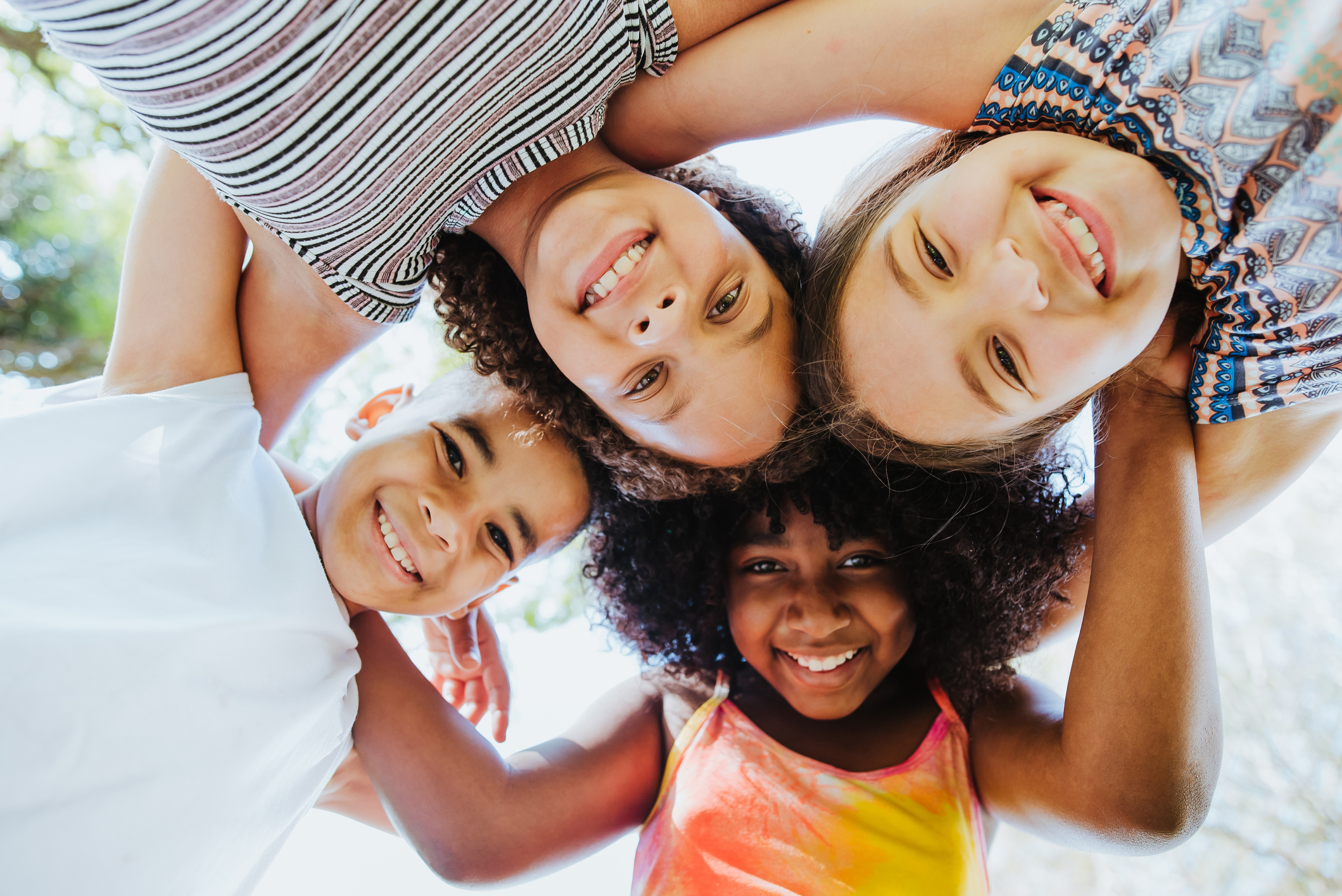 Group of children smiling and looking at the camera diversity