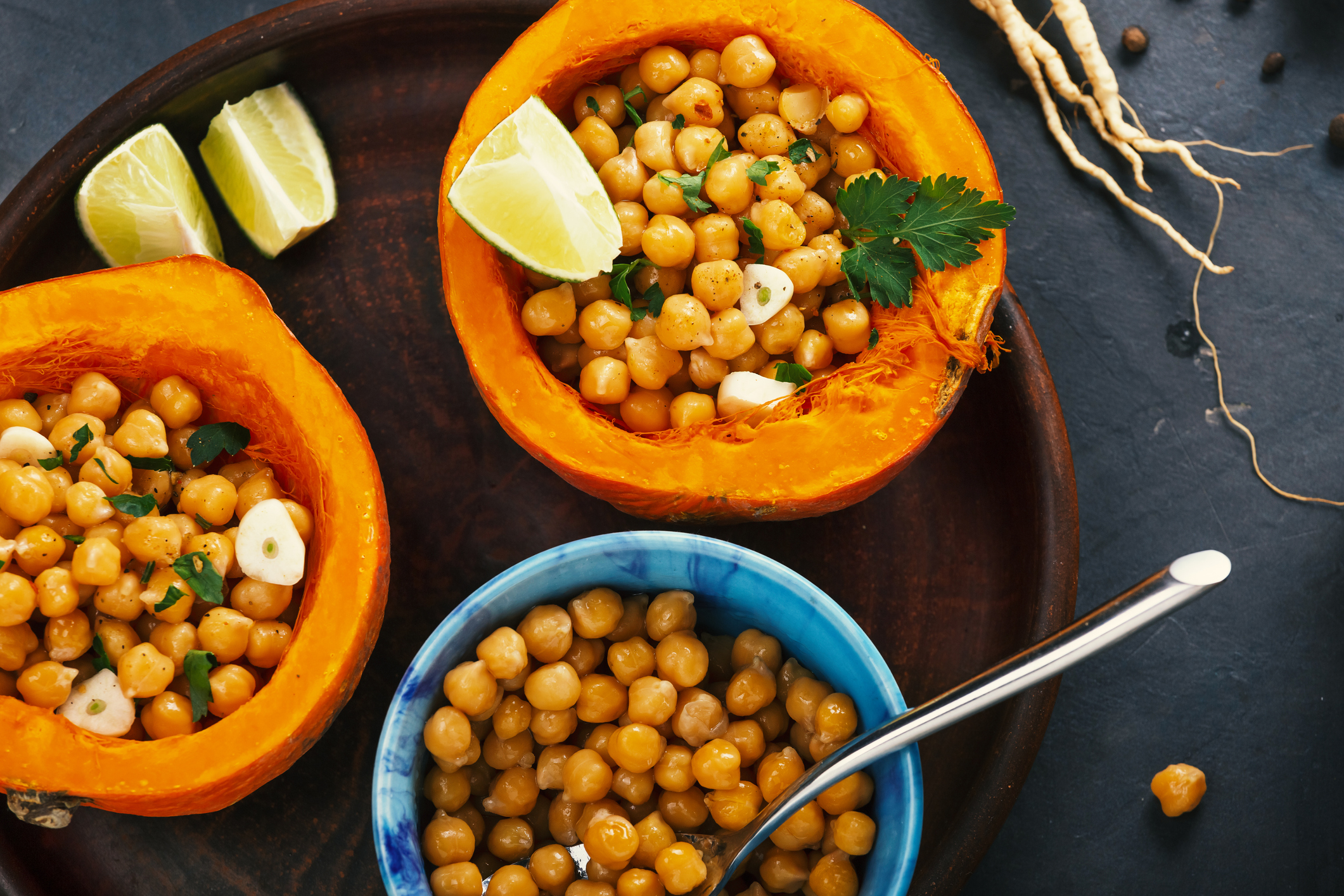 Vegetarian food hokkaido pumpkin with chickpeas and herbs, top view