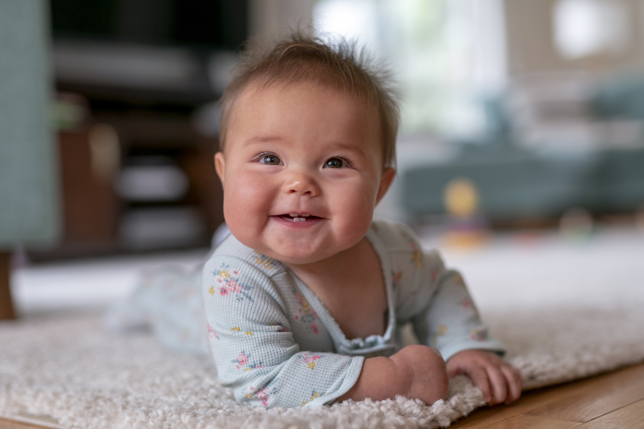 Happy baby doing tummy time