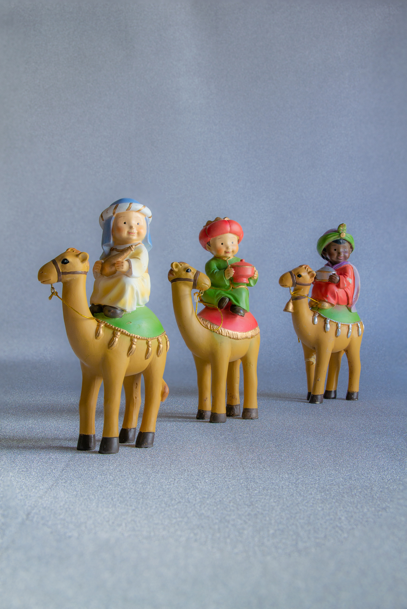 Close-up of figures of the Three Wise Men from the East Christmas concept and tradition. Vertical photography and copy space