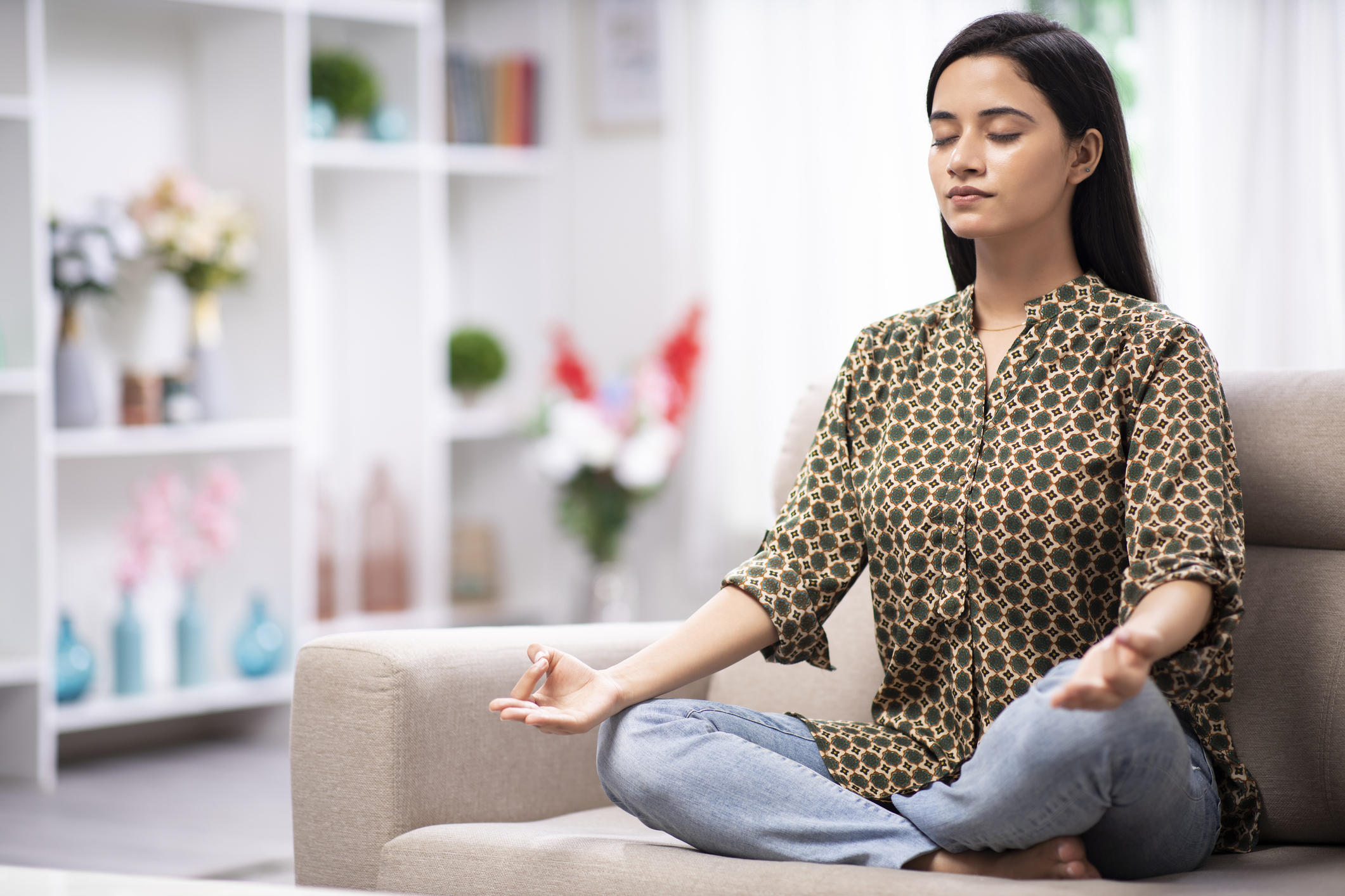 Woman at home sofa sitting - stock photo