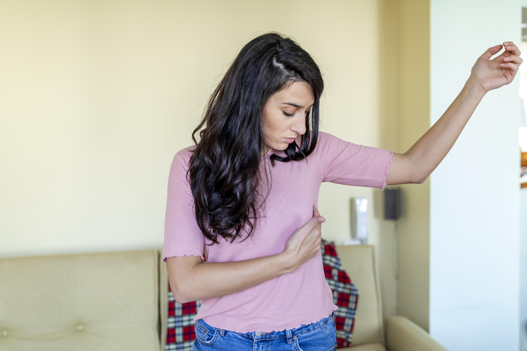 Young Woman with a pain in the breasts. portrait of an attractive young woman holding her chest