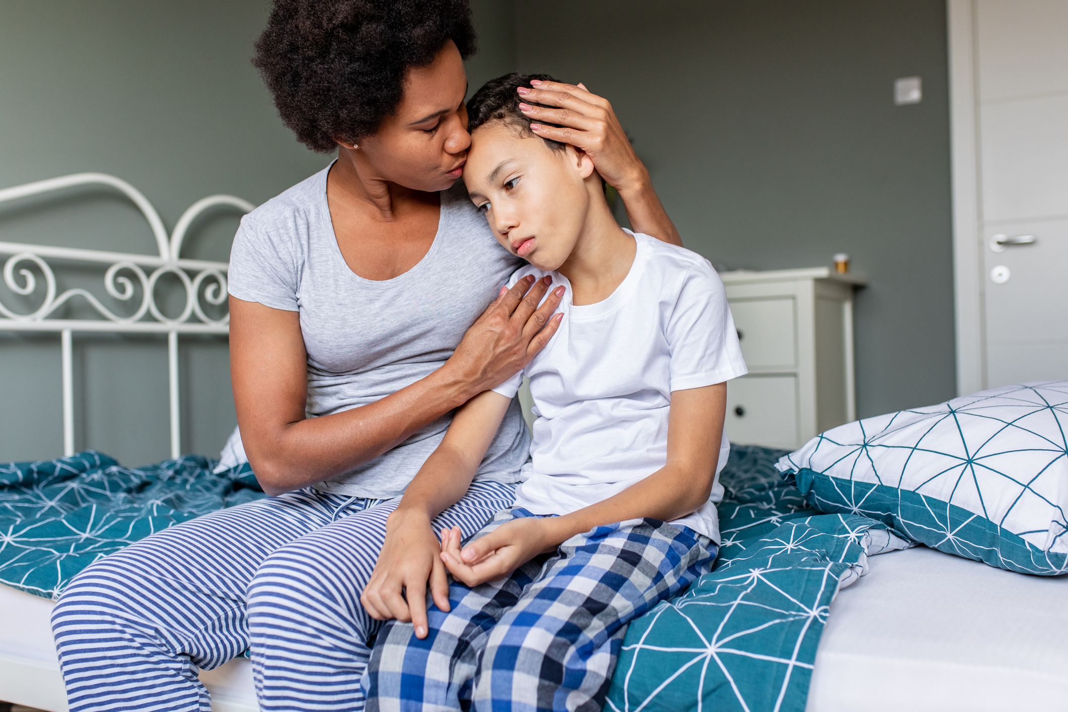 Mother comforts her son