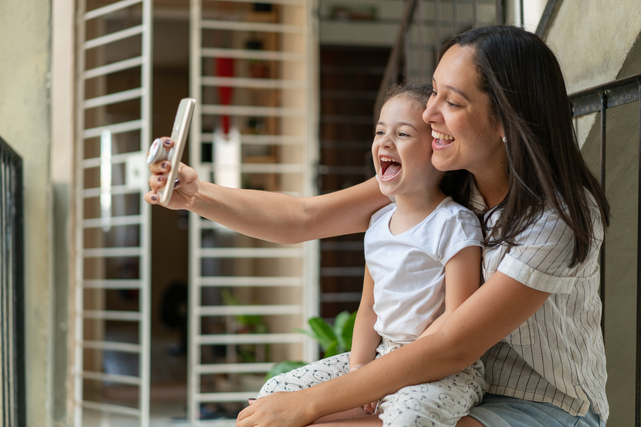 Mother and daughter talking by video call