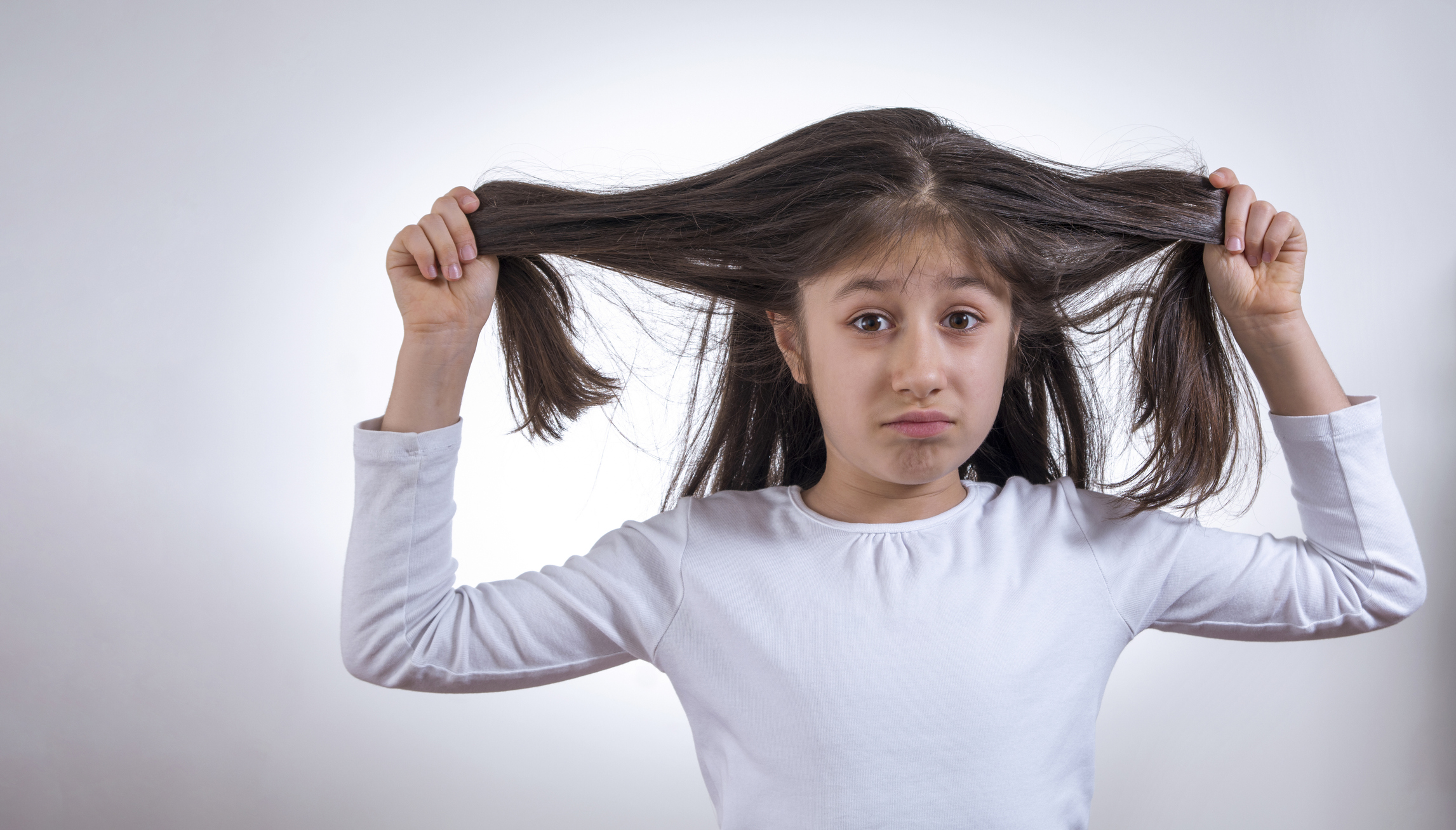 unhappy girl pulling her hair stock photo