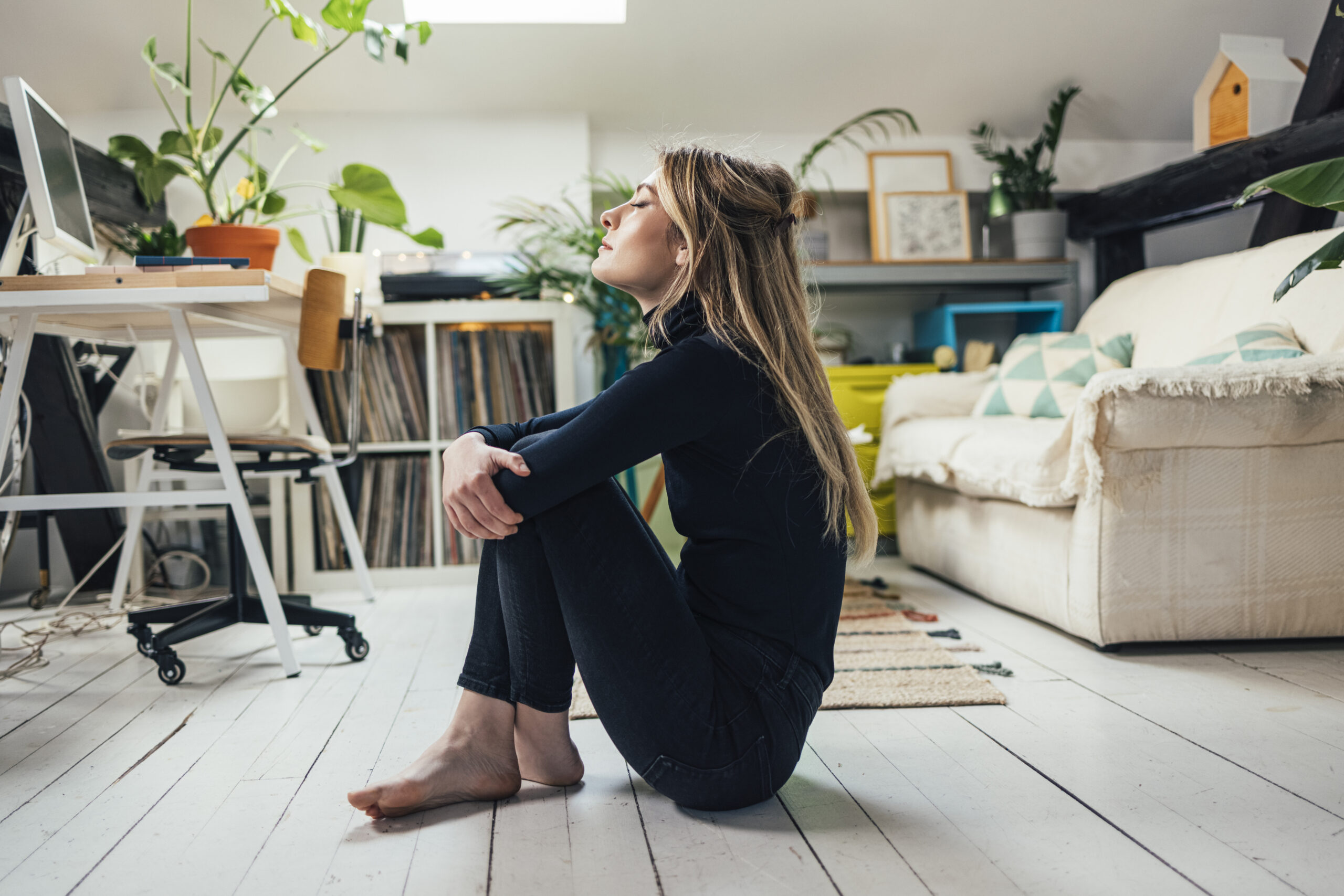 New Normal Concept: Young Beautiful Caucasian Woman Spending her Free Time Alone in her Studio Apartment