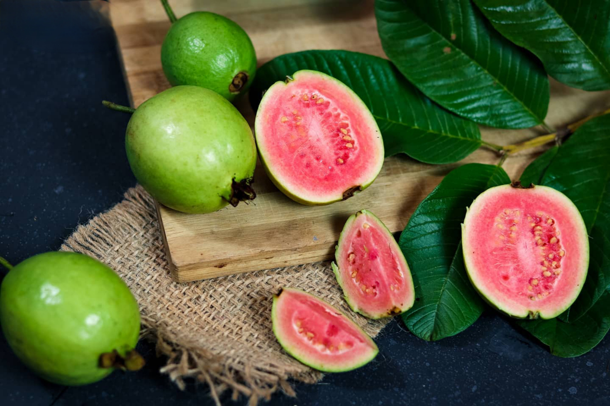 guava fruit on black background