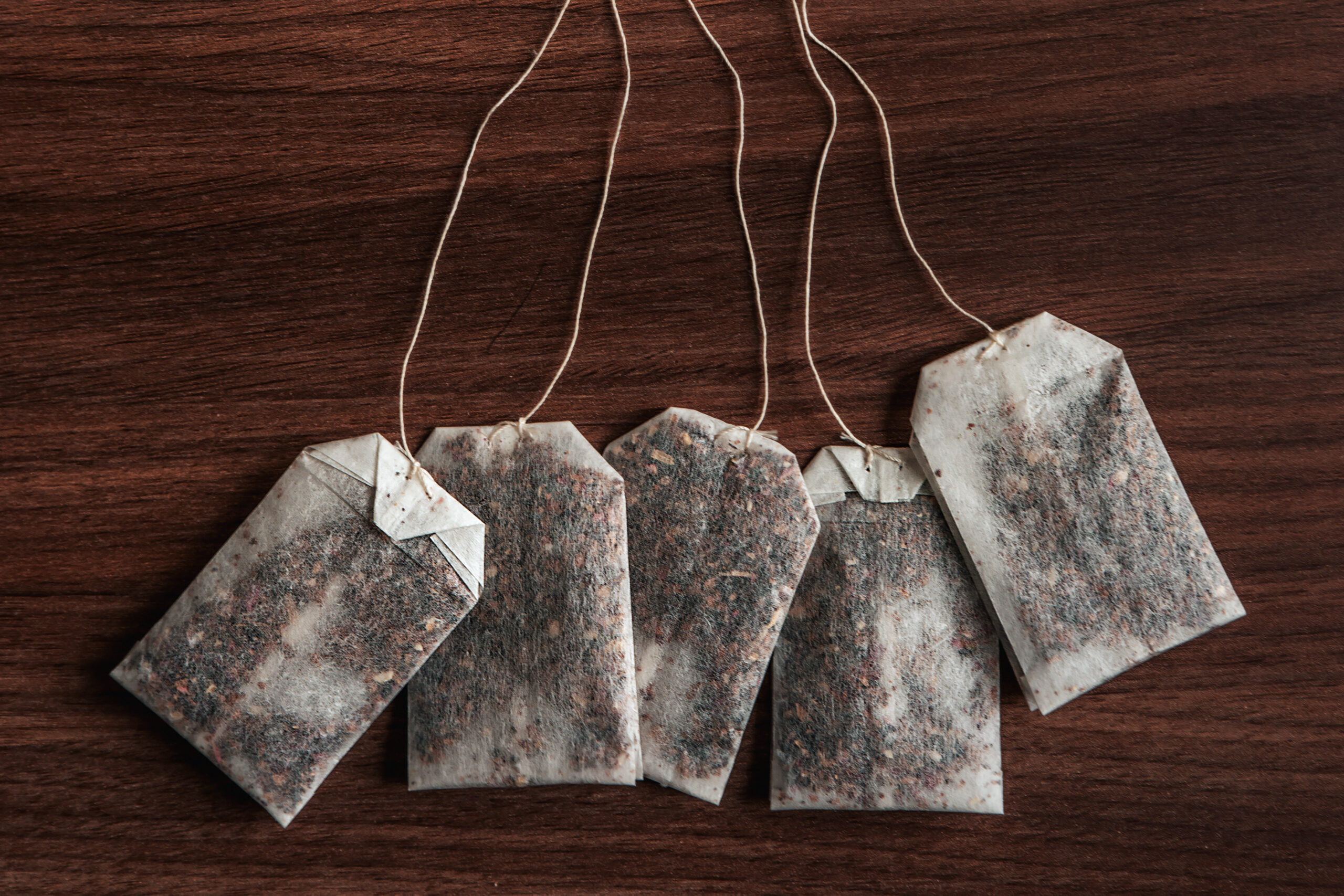 Tea-bags on walnut background