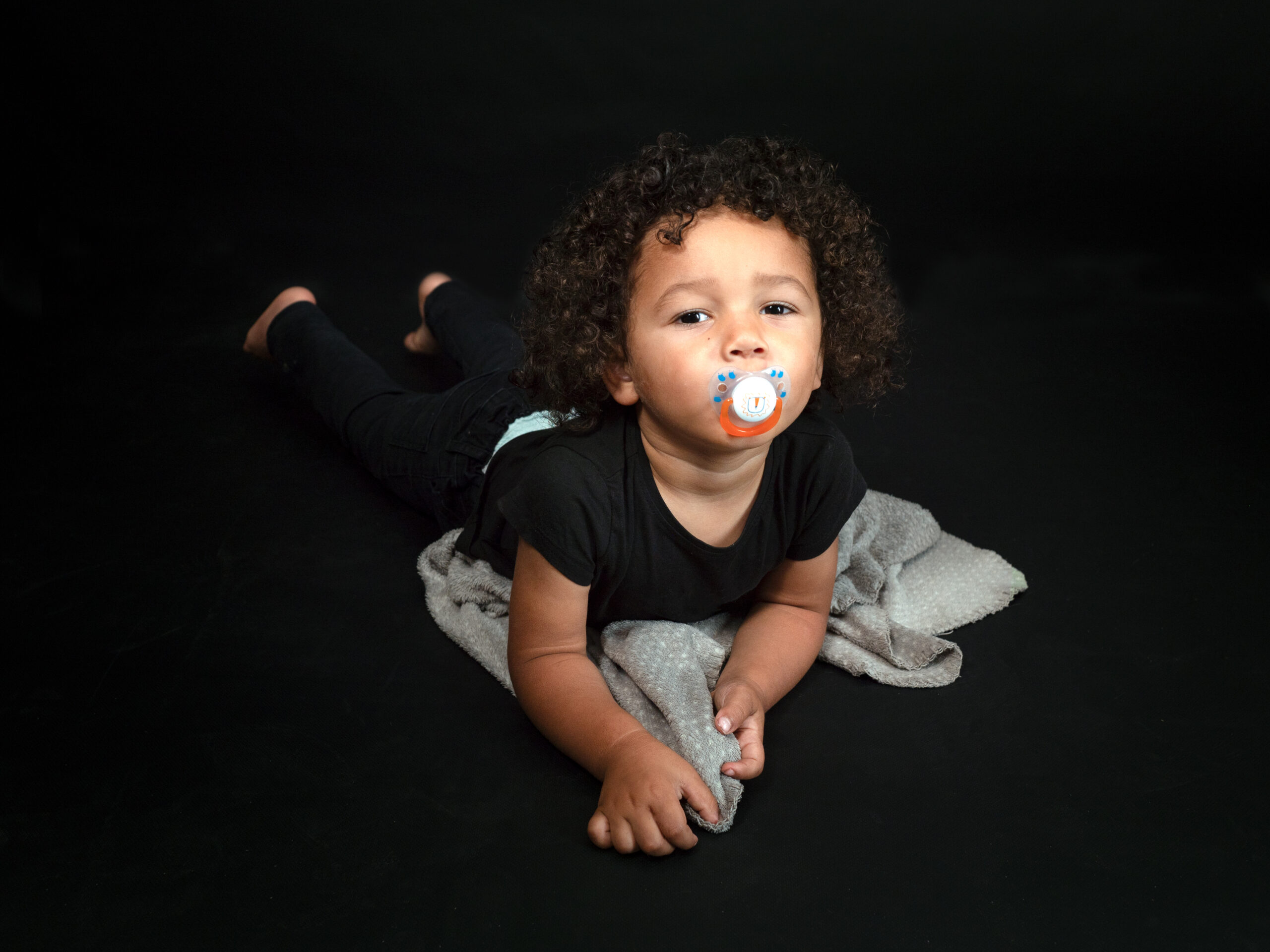 Beautiful mixed race 2 years and half old boy with pacifier