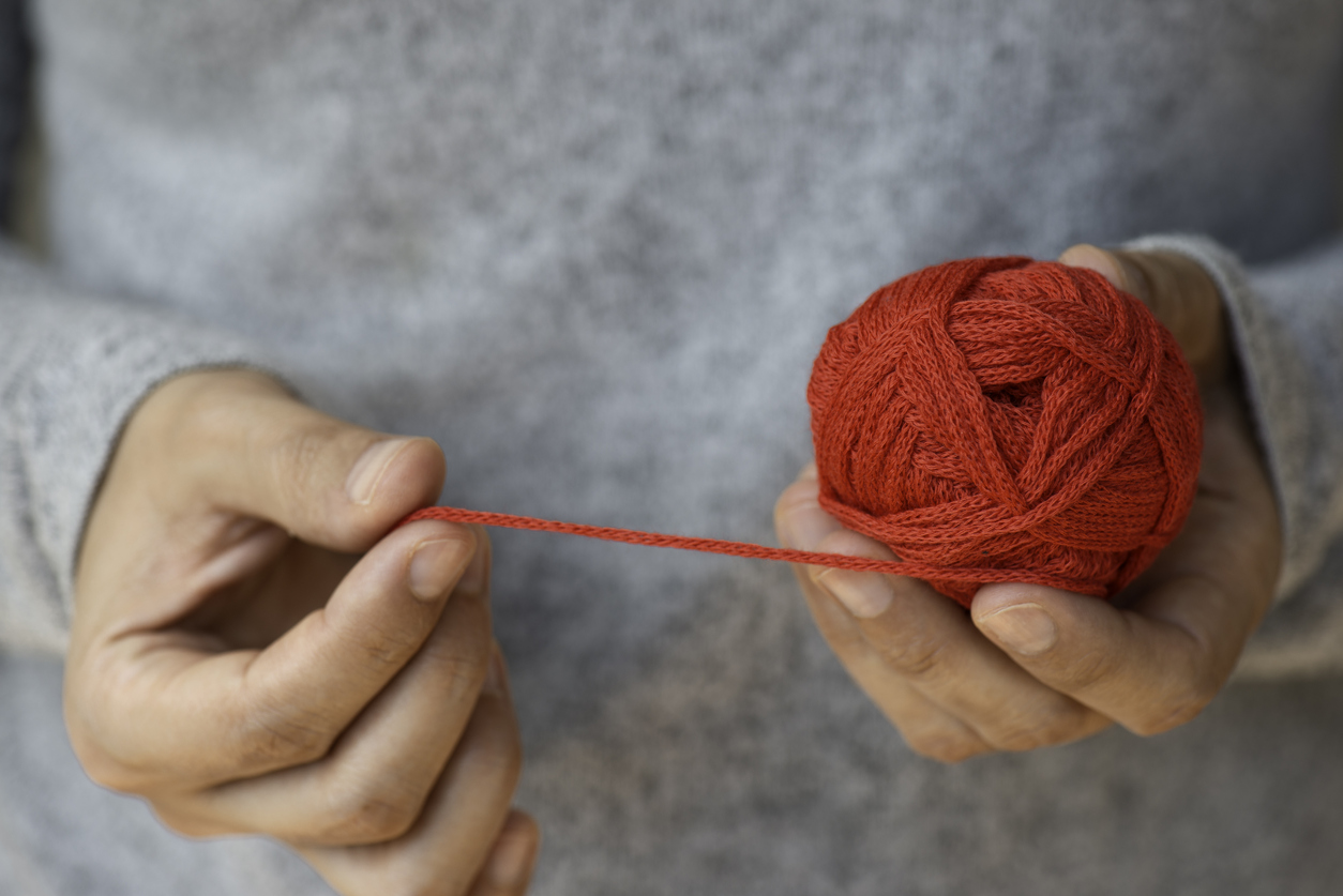 Hands Holding A Ball Of Wool