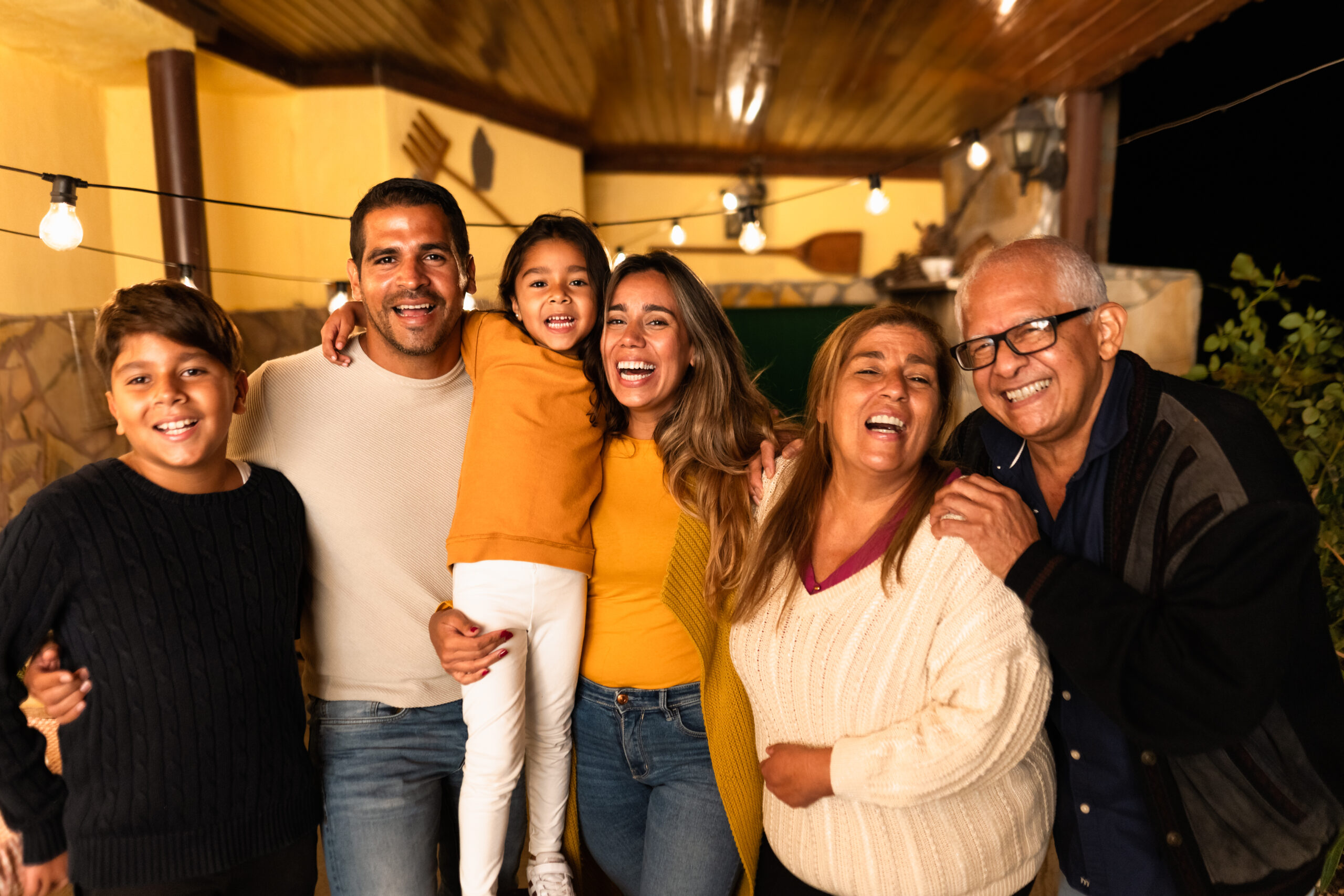 Happy Hispanic family enjoying holidays together at home