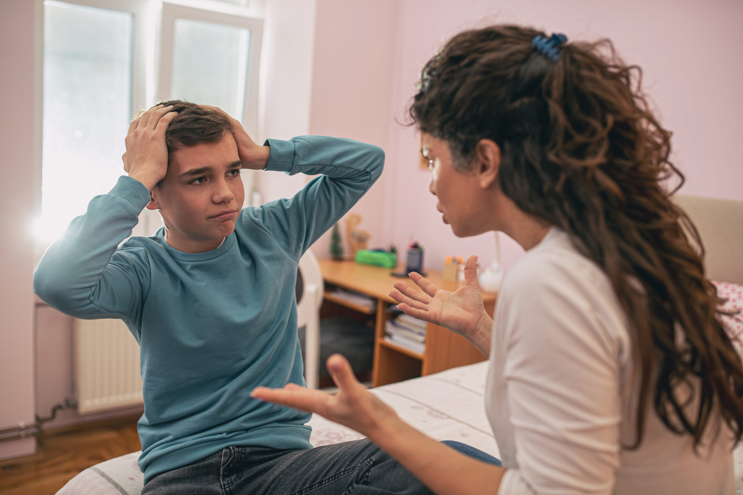 Mother and son having arguing and serious talk