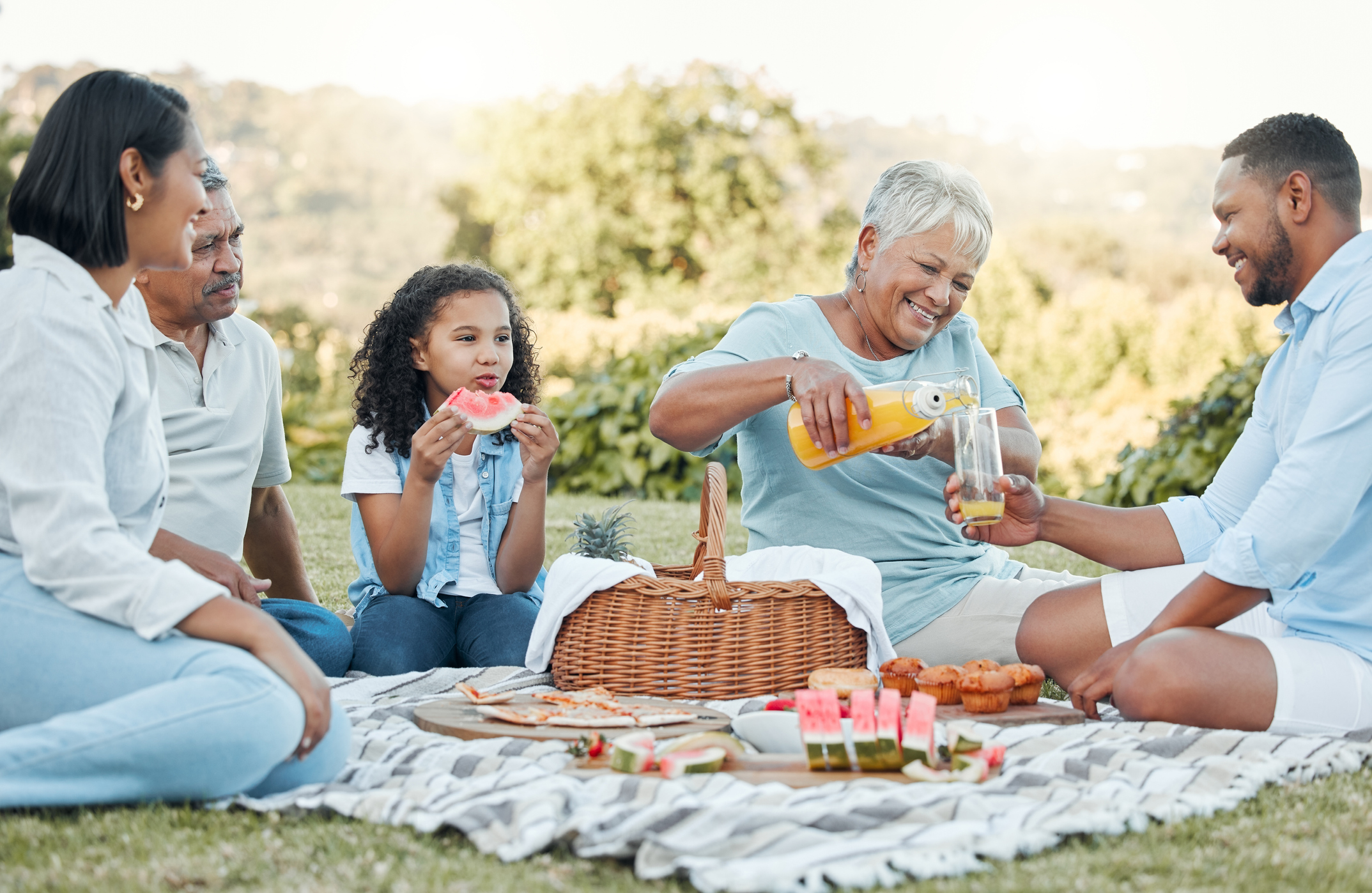 Shot of a family enjoying a picnic in a park