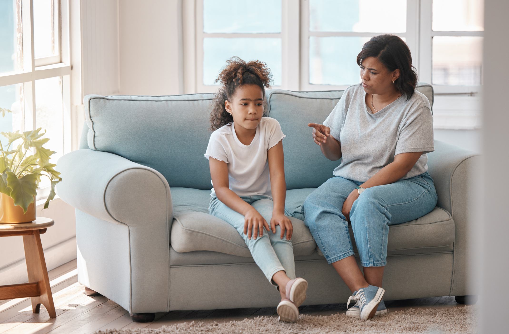 Shot of a young mother scolding her daughter