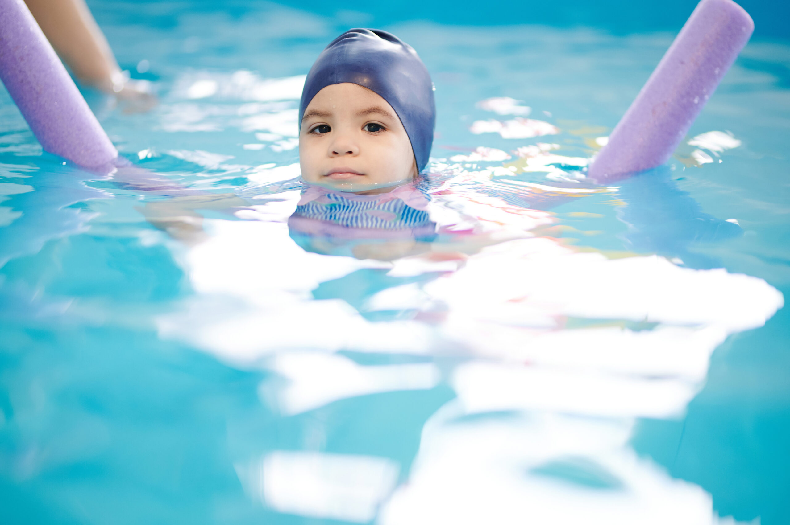 Cute little girl learn to swim