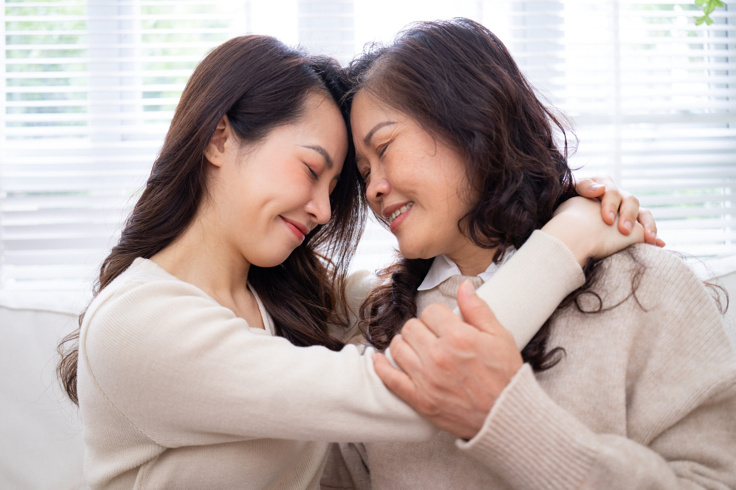 Image of Asian mother and daughter at home