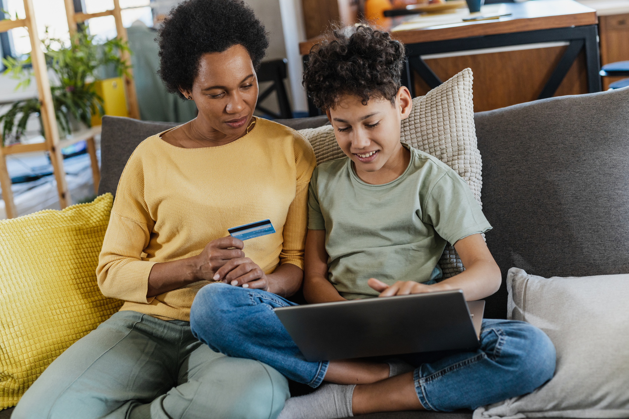 Mother and son shopping online