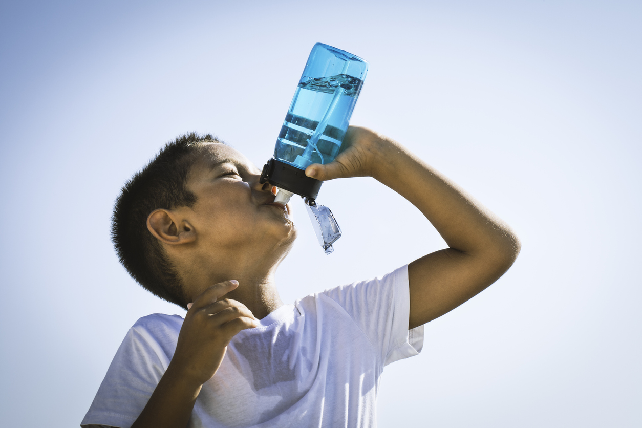 Cute Boy Drinking Water