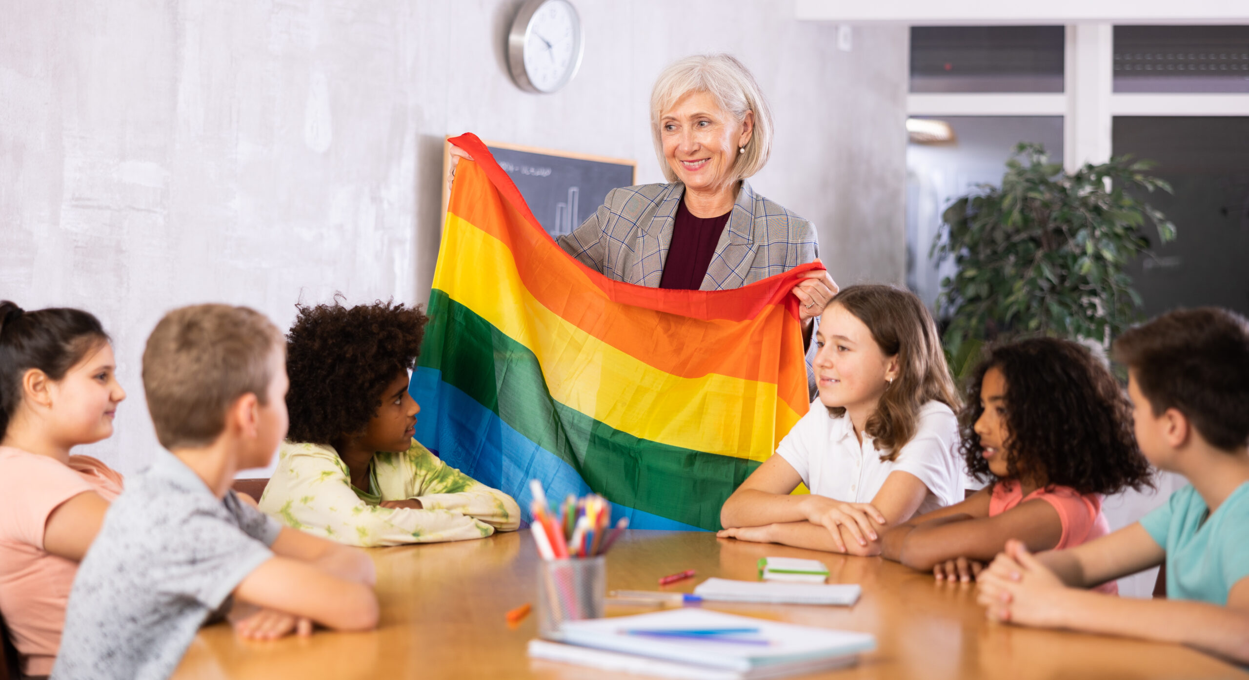 teacher introduces children to concept and history of LGBT community