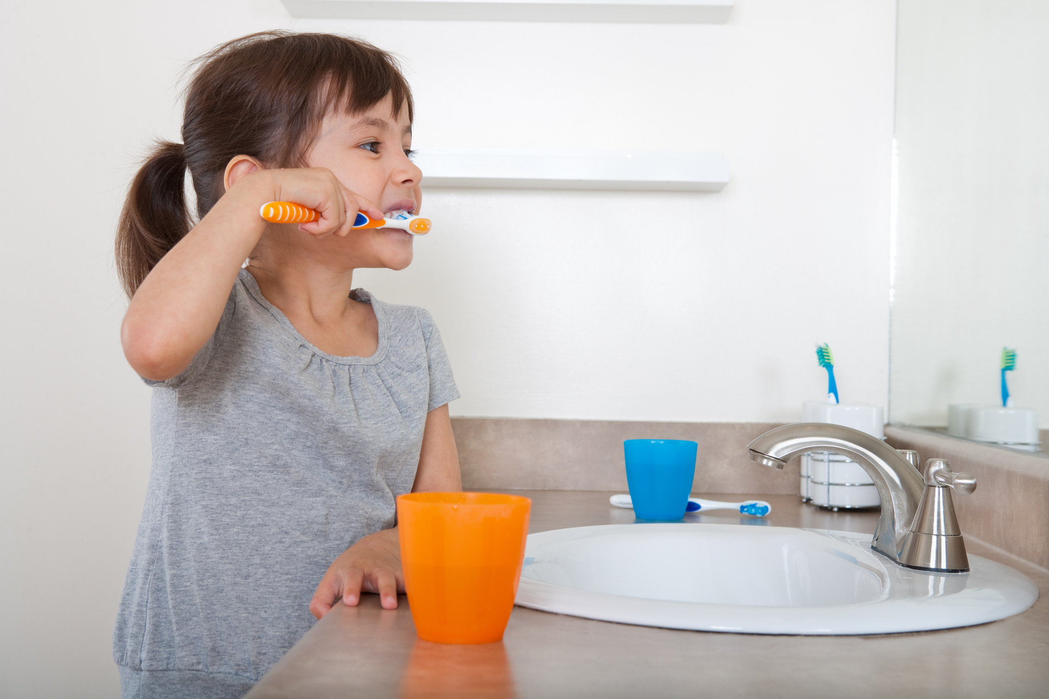 Girl brushing teeth