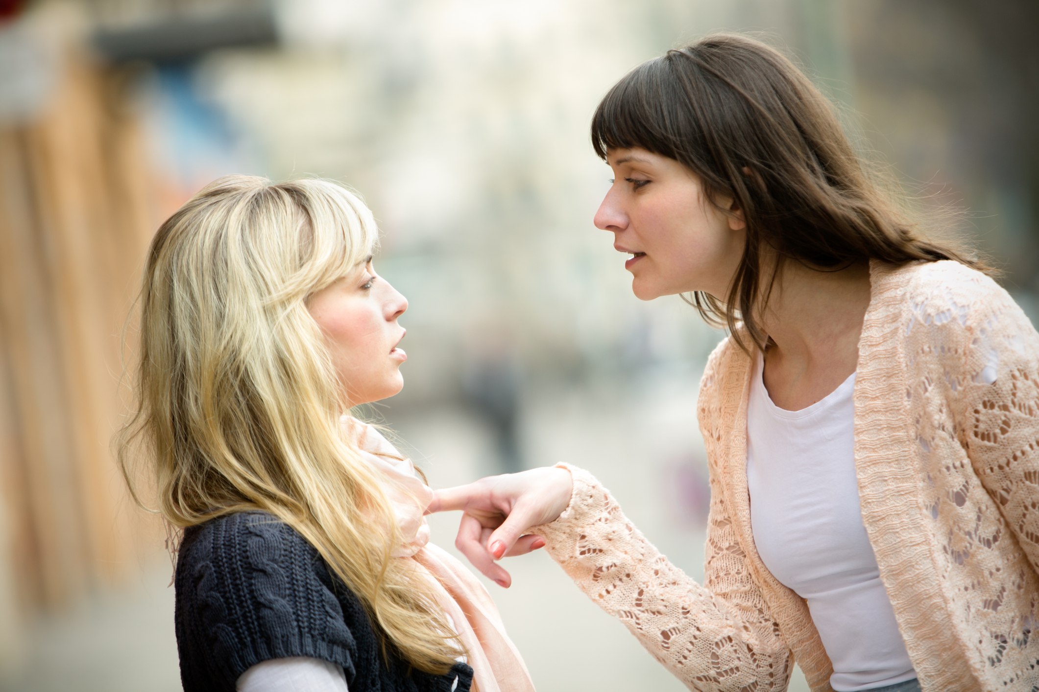 Two women arguing on the street