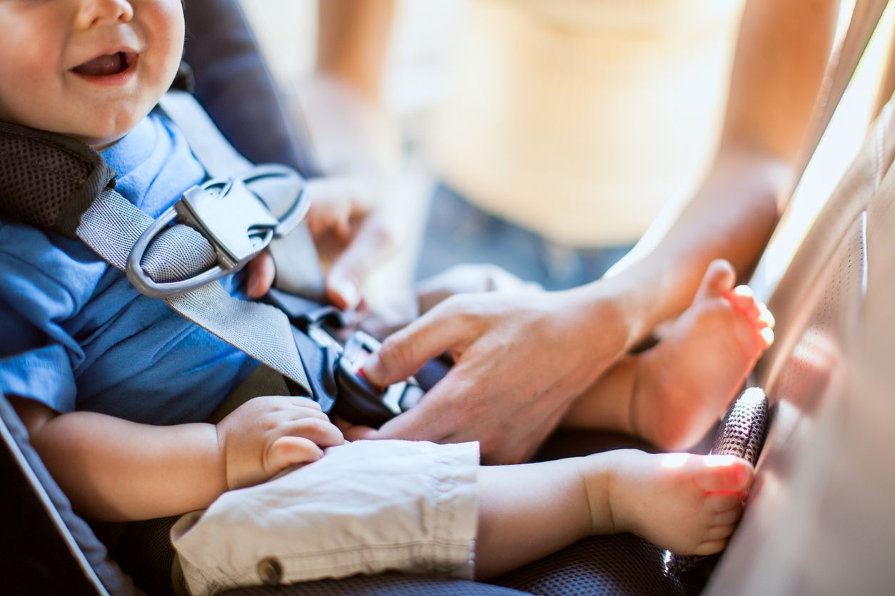 Baby and Mother Strapping in Carseat