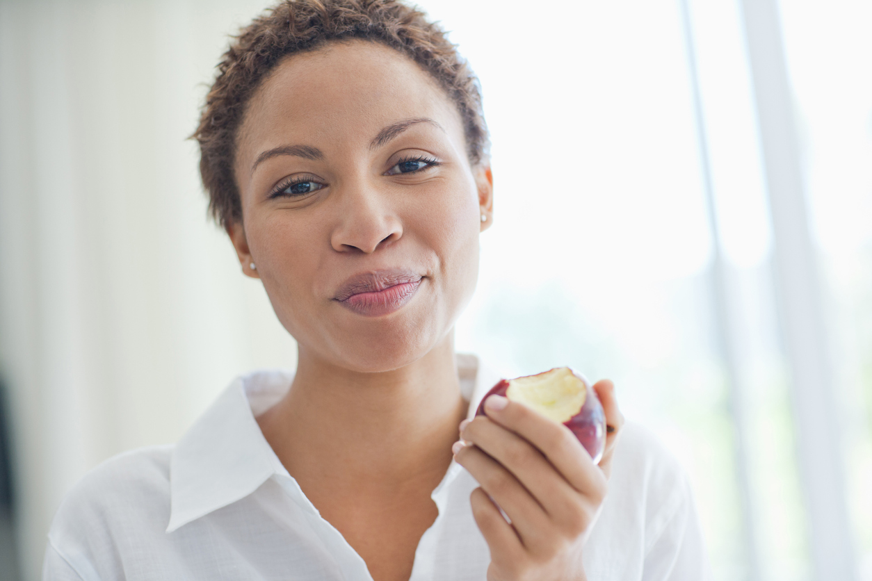 Woman eating apple