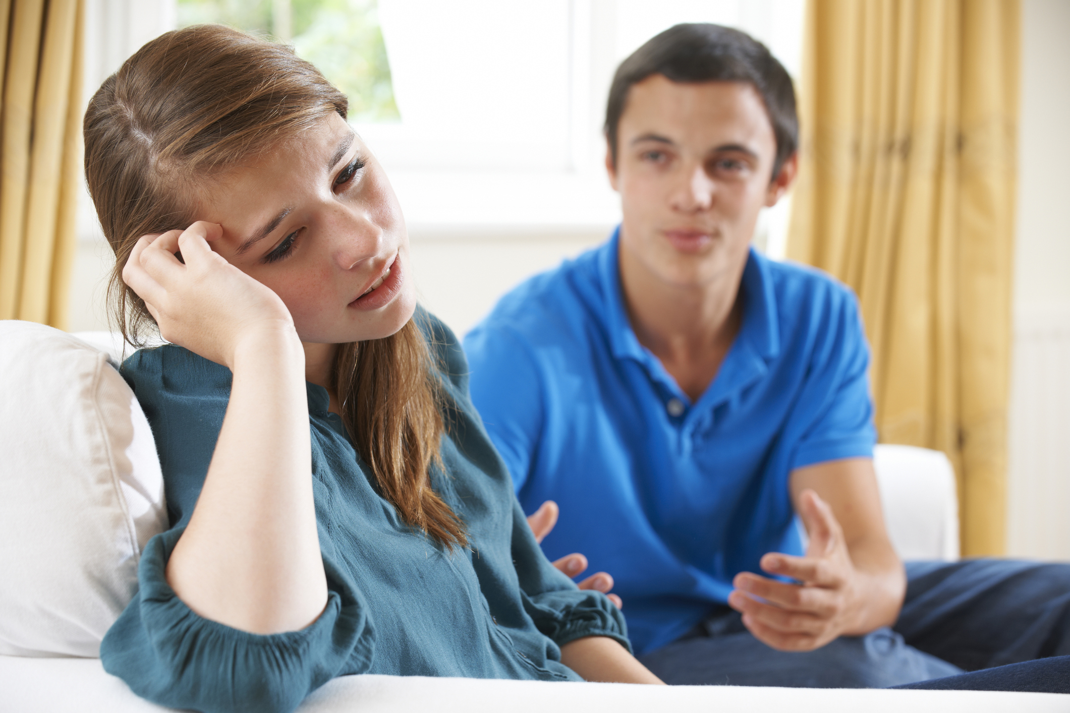 Teenage Couple Having Arguement At Home