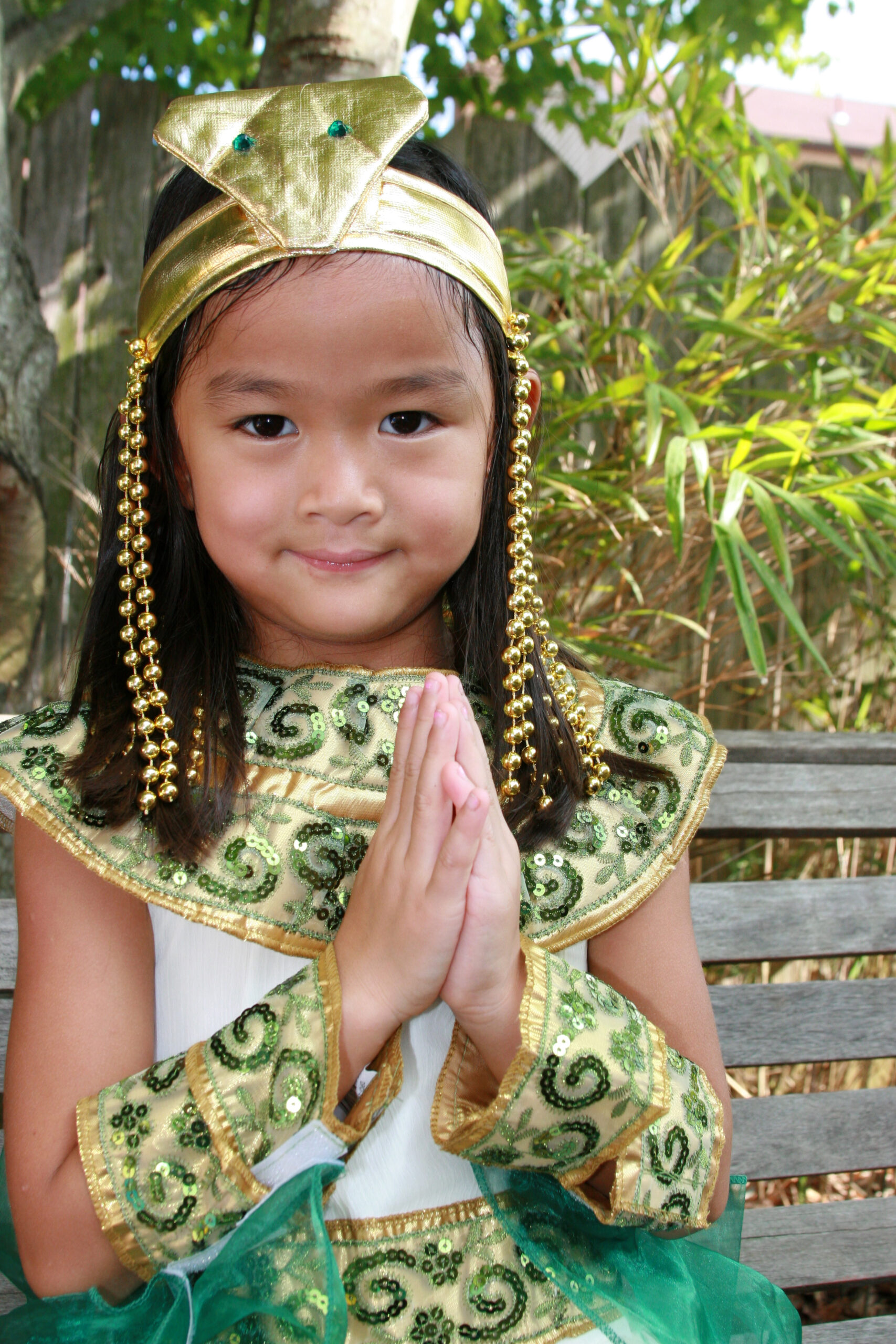 Asian child dressed up like Cleopatra