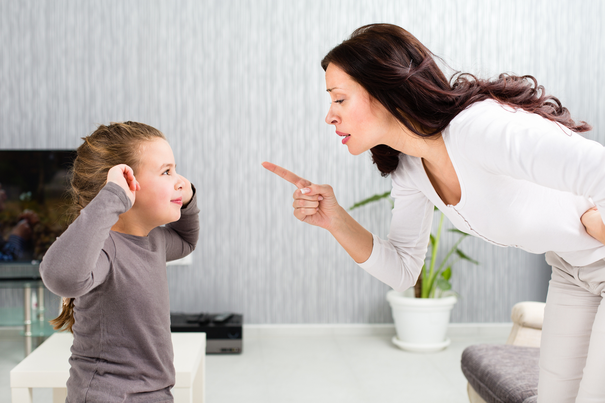 Mother scolding daughter