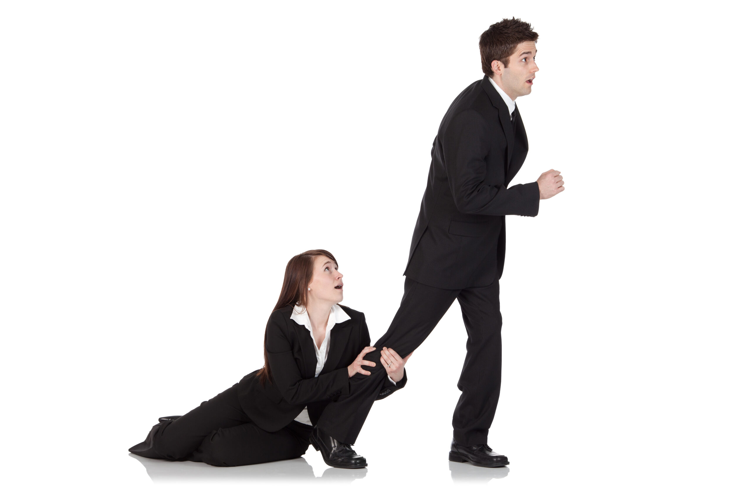 Businesswoman holding the leg of a businessman