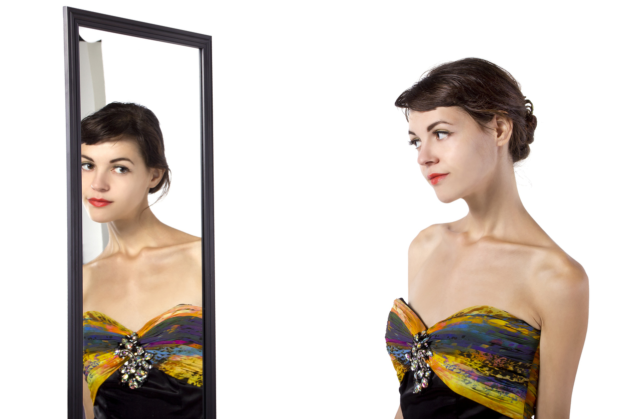 Woman Looking at Mirror