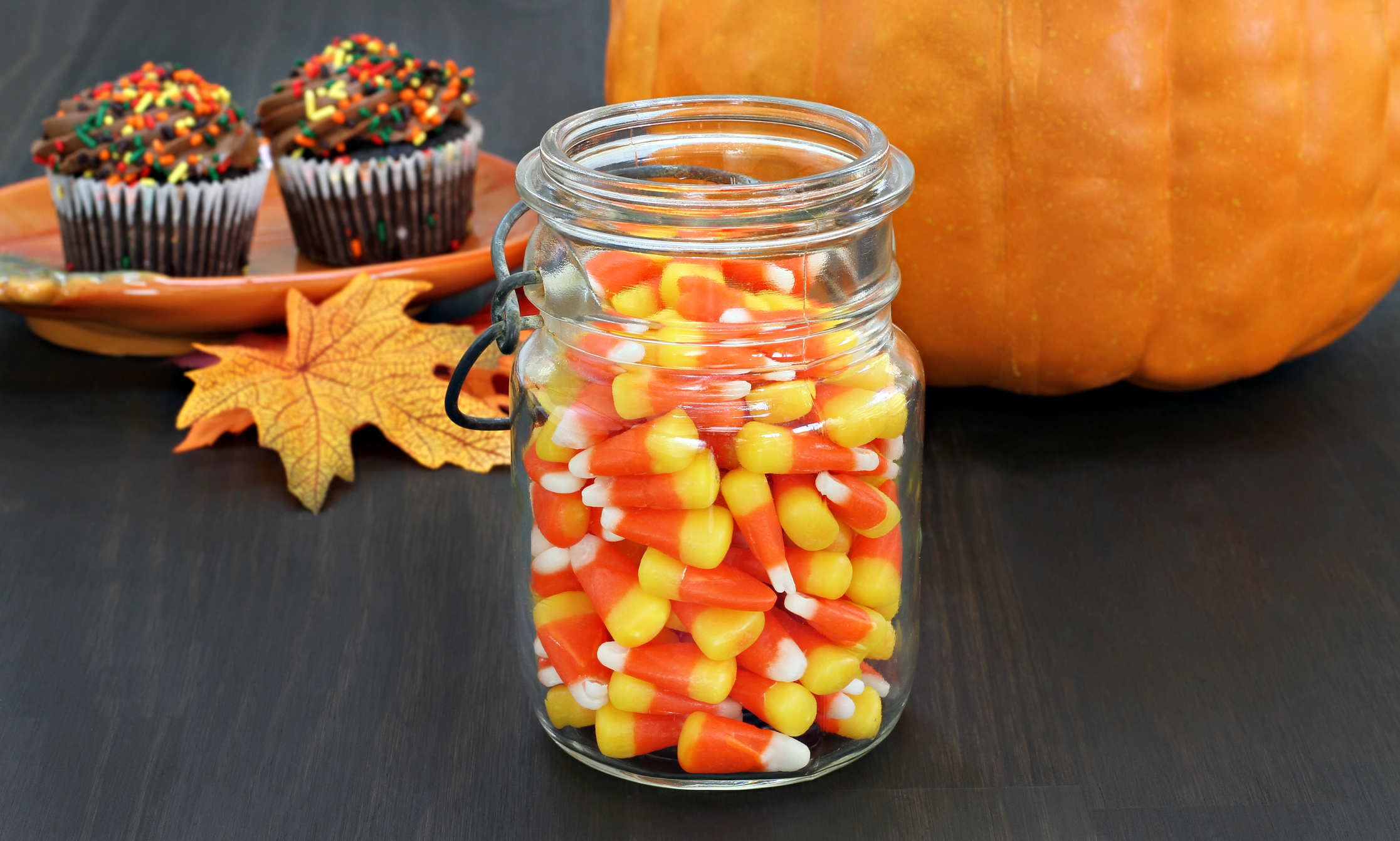 Candy corn in a rustic mason jar.