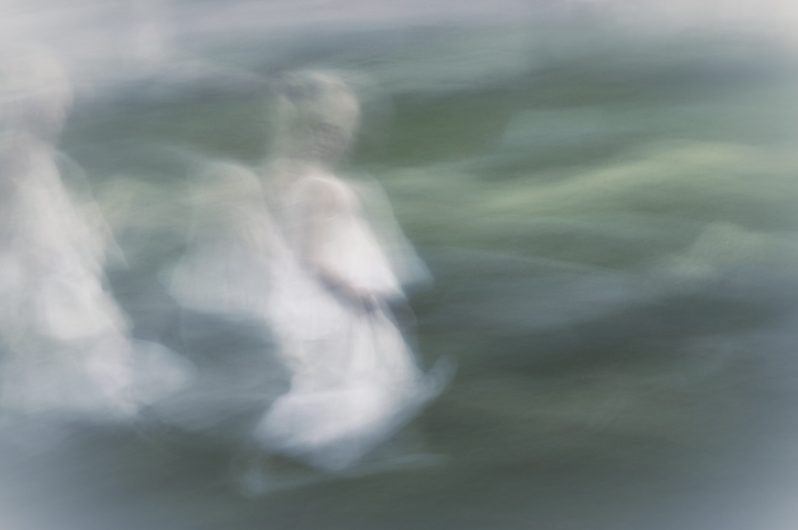 Young angel moving through diffused background