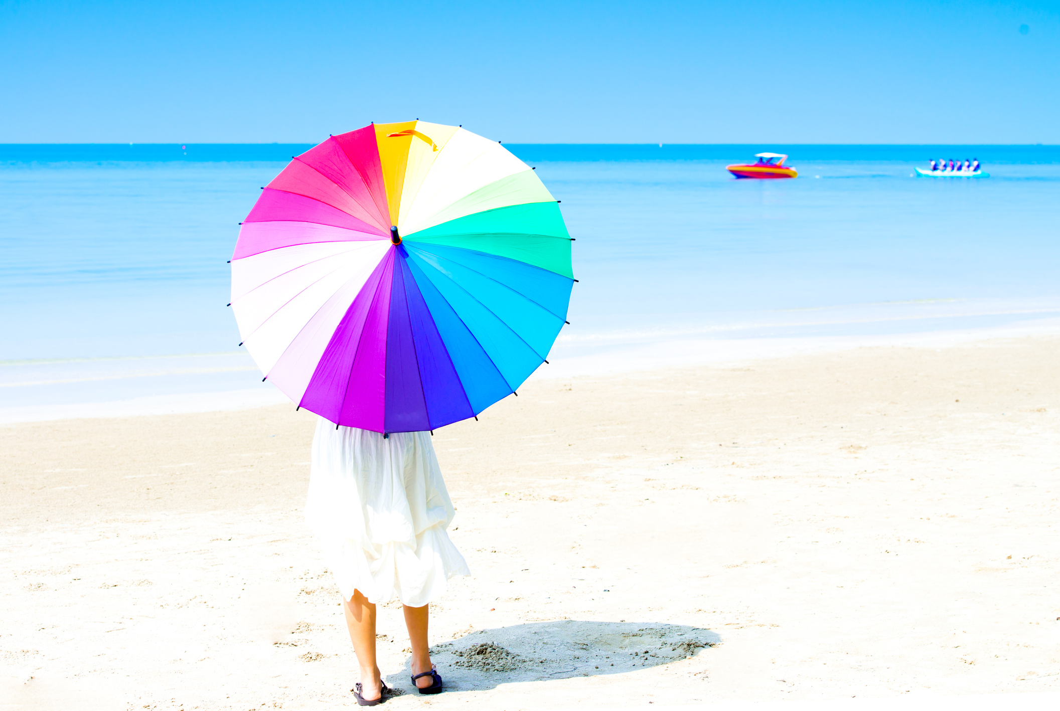 Woman  holding an umbrella with a bright smile