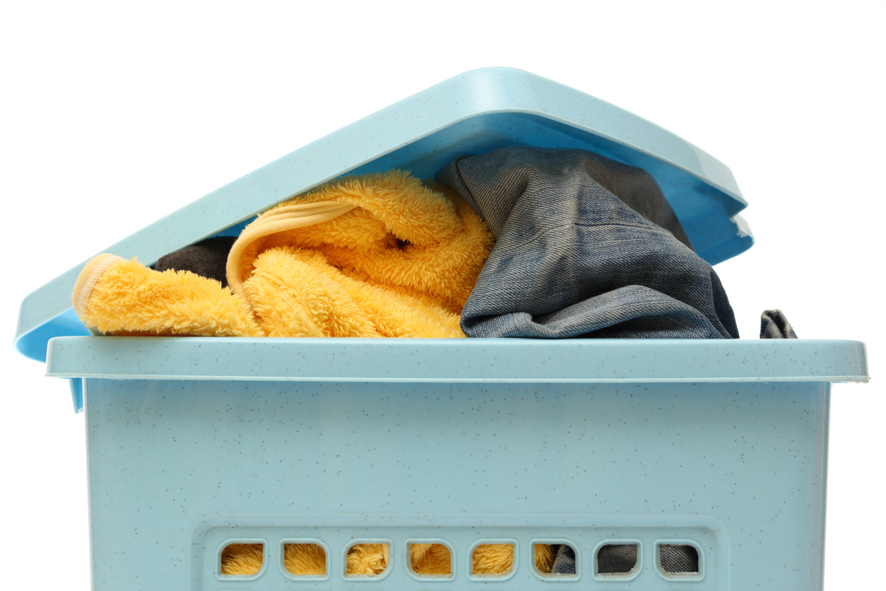 Plastic basket with clothes