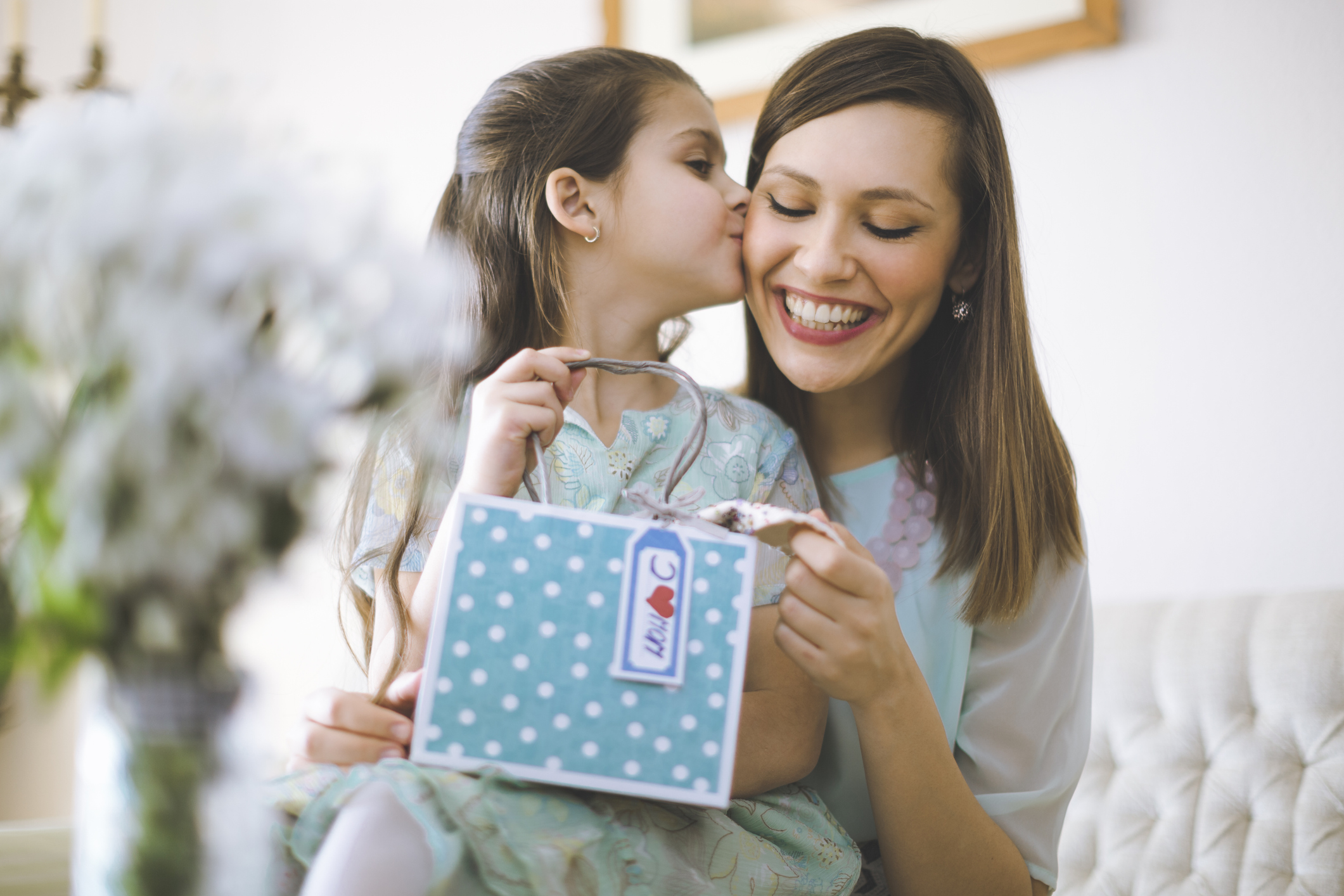 Happy mother posing with her daughter