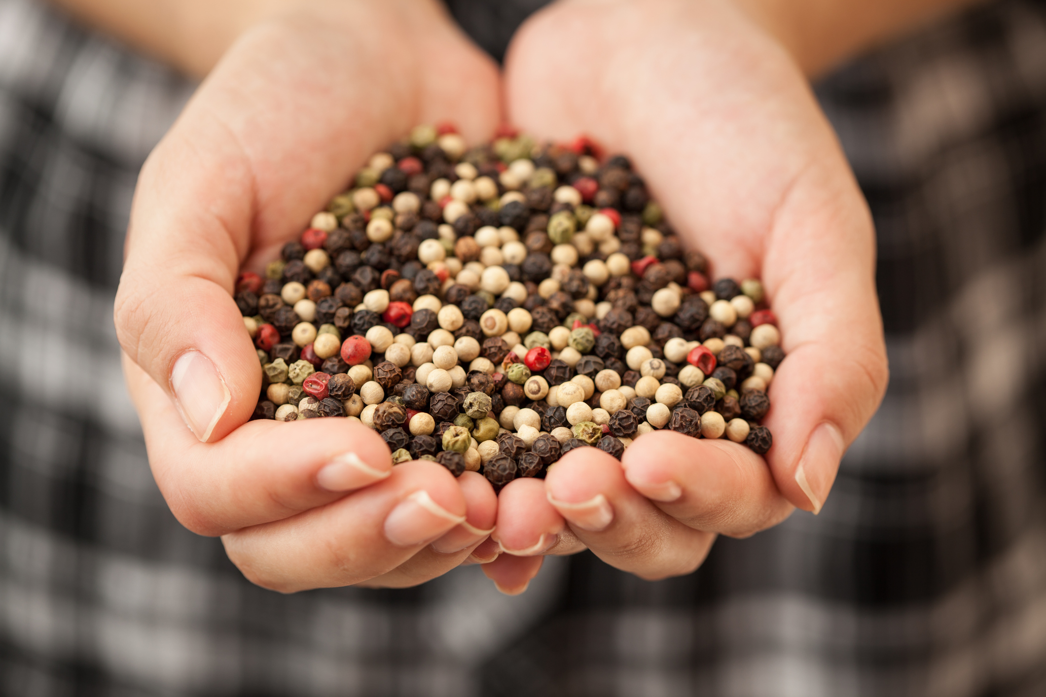 Woman holding peppercorns