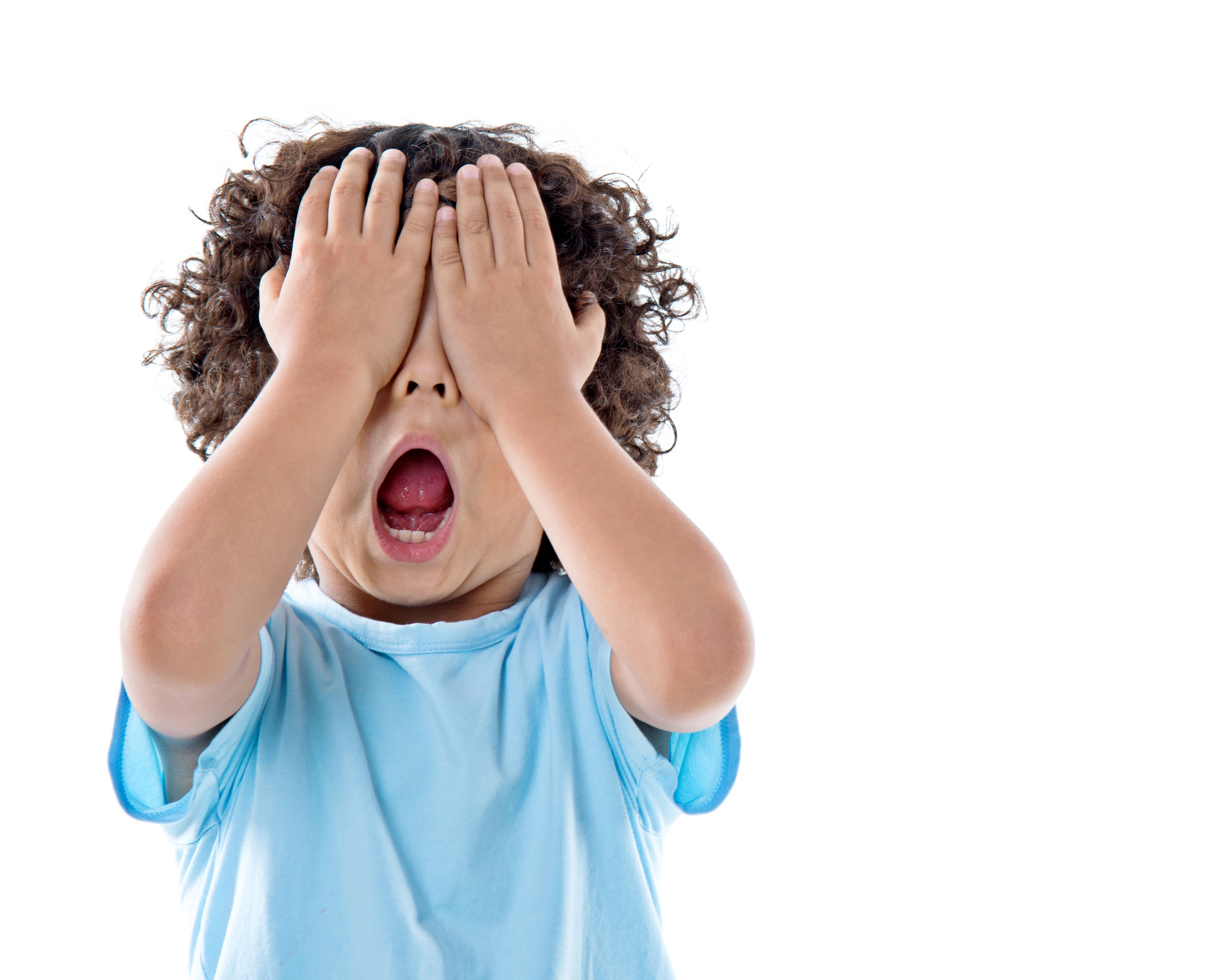 Little asian boy covering eyes against white background