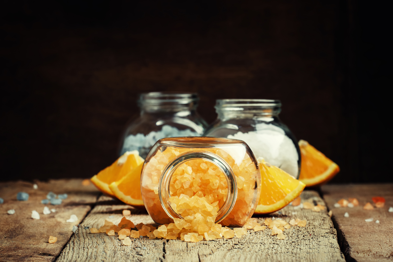 Orange bath salts in a glass jar