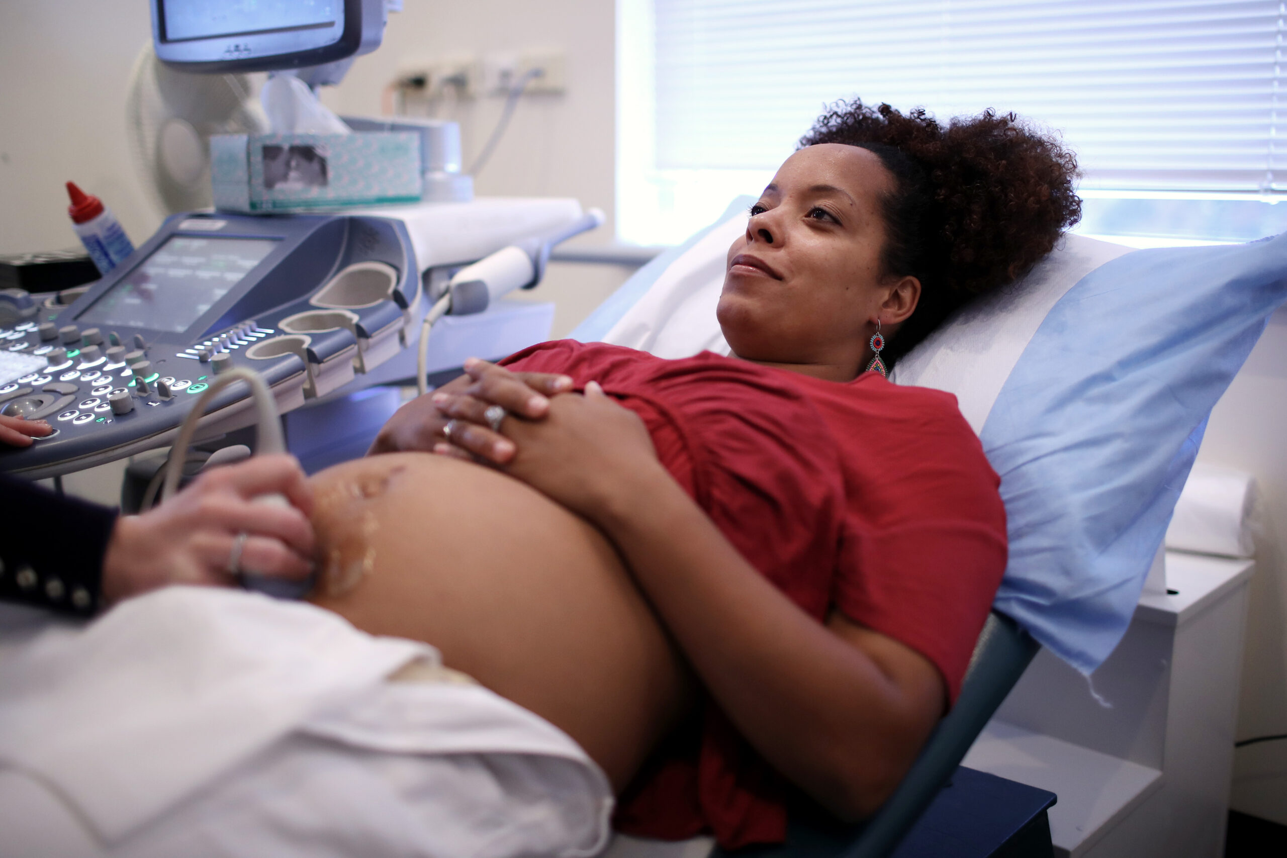 Happy Pregnant Woman Having Ultrasound Scan