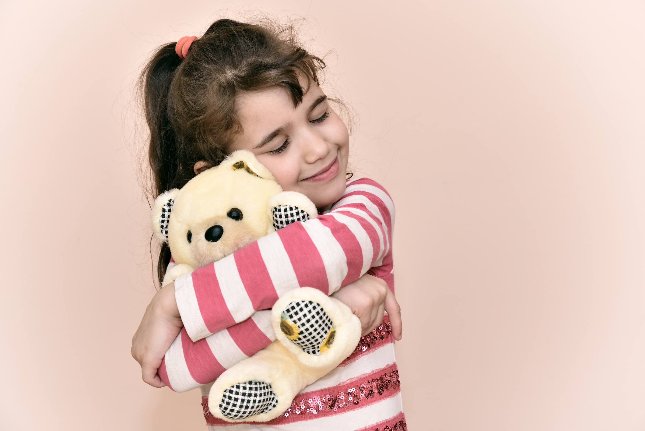 Young girl and teddy bear