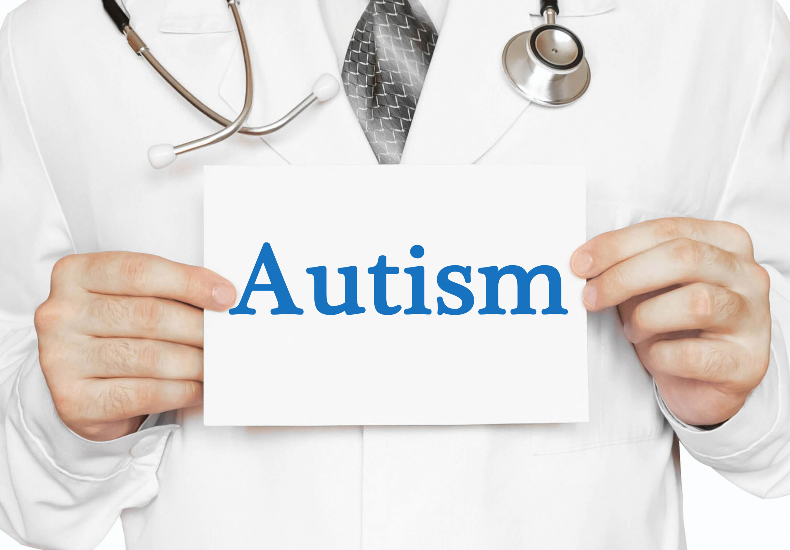 Doctor holding a card with Autism, Medical concept