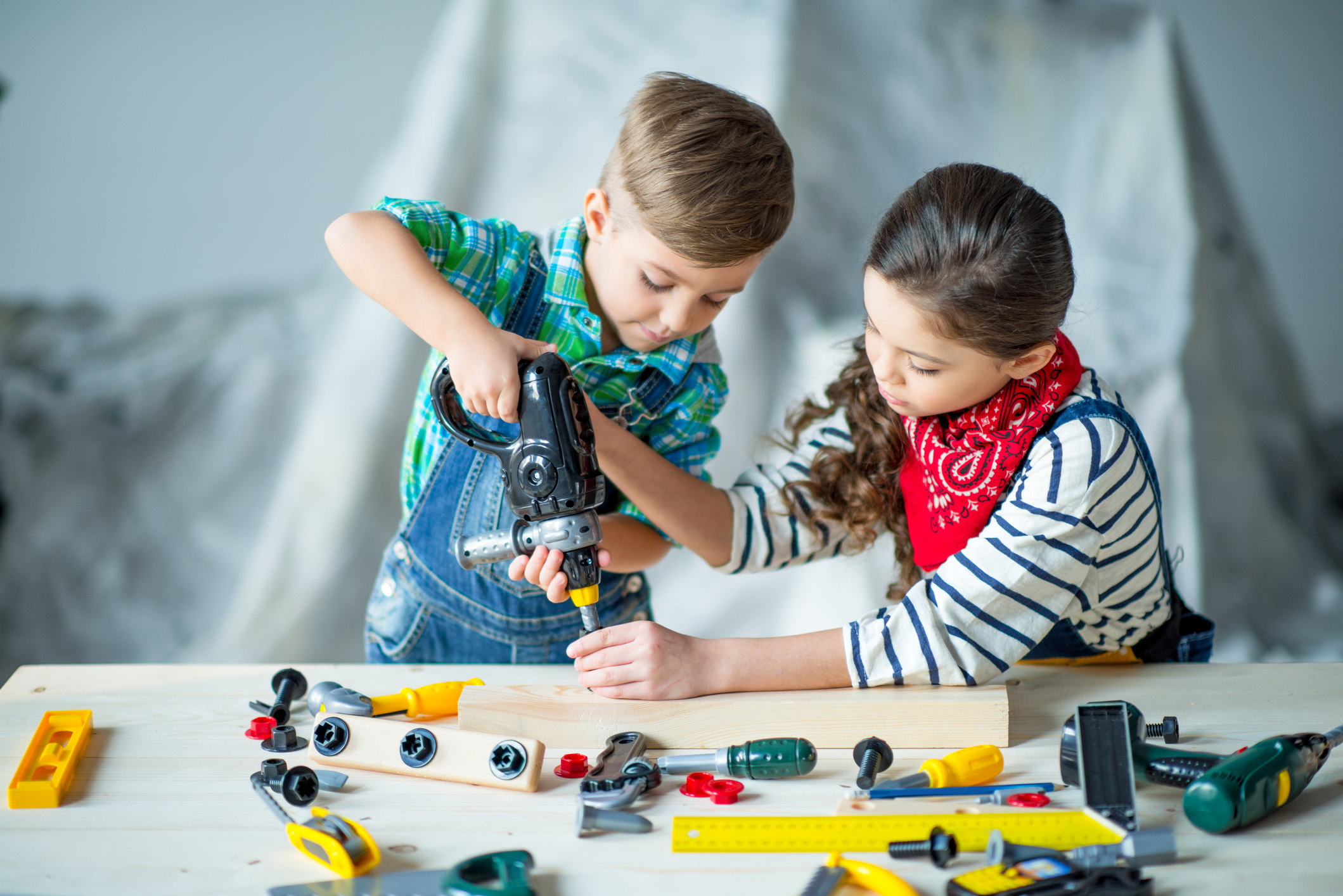Boy and girl with tools